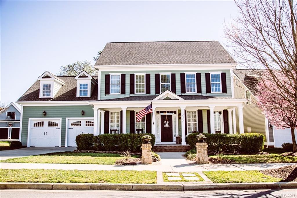 Absolutely Stunning 4Br+Bonus & 3.5Ba Evans Coghill Home on a Premium Lot in Baxter Village!! Custom finishes throughout! Gorgeous Stone Fireplace, Built-ins & Upscale Lighting! Rock away on the large front porch, relax on the beautiful covered back porch, or step down to the custom patio & gather w/ friends & family! Large, fenced yard w/ extensive mature landscaping borders a greenspace and the Baxter Trail System. Steps to the Playground, Pool & Village Hall! Southern Charm at it's finest!
