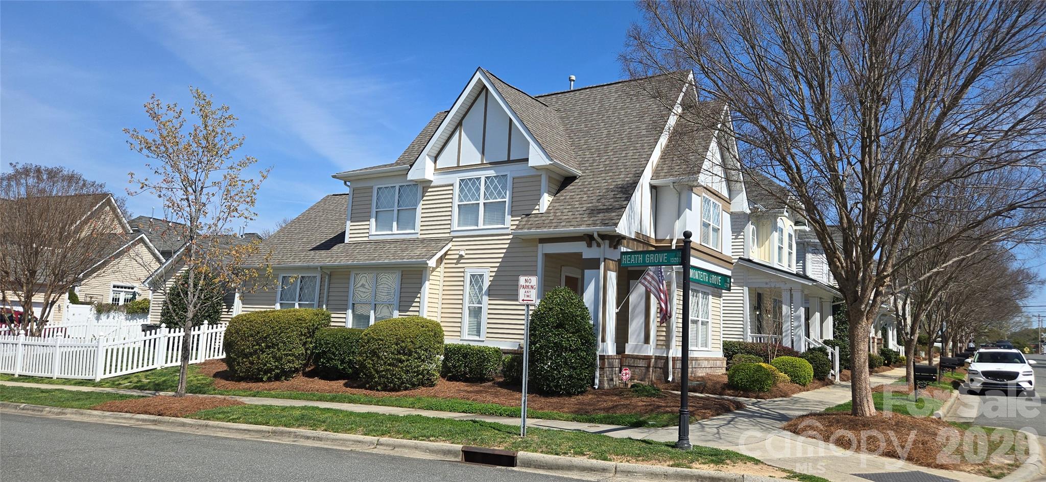 This thoughtfully designed residence blends comfort, functionality, and timeless style. Featuring three bedrooms and two-and-a-half baths, the home offers the convenience of a main-level primary suite and a bright open-concept layout ideal for both everyday living and entertaining.

The inviting great room centers around a warm fireplace and opens to a well-appointed kitchen complete with granite countertops, stainless steel appliances, and a large island with seating and ample storage.

The private primary suite showcases tray ceilings and a spacious spa-style bath featuring a soaking tub, separate glass shower, dual vanities, and a walk-in closet.

Upstairs, a versatile loft provides additional living space alongside two secondary bedrooms, a full bath.

Outdoor living includes a fully fenced backyard with a covered patio, detached two-car garage, and additional storage area. Residents enjoy a tranquil community walking trail surrounding a scenic pond.

Ideally located with convenient access to I-77, I-485, Birkdale Village, parks, aquatic center and downtown Huntersville.  Move-in ready with fresh paint!  Tons of natural light with being on a corner lot!
