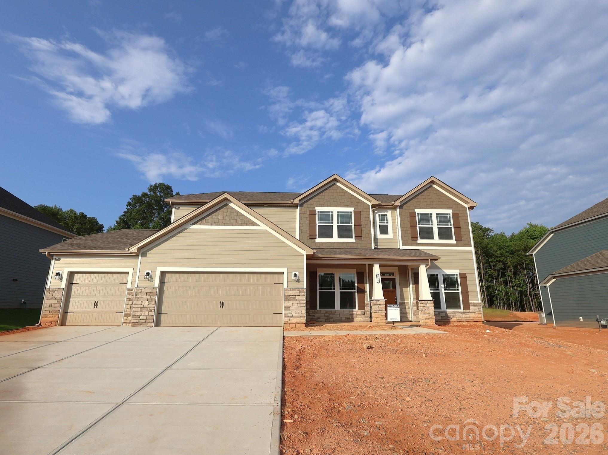 Welcome to The Bristol located in the new community of Amber Glen in Locust! From the exterior, you'll notice the garage has been extended to include a carriage garage, perfect for an extra workspace or for guests to have a secure place to park. Walking in from the front covered porch you are greeted with a warm and inviting foyer. Just off the foyer is a formal dining room to enjoy a more intimate meal. There is a main level guest bedroom and full bathroom that is perfect for guests or to turn into a home office. The home will open up into your kitchen, family room and breakfast area. The kitchen is fit for a chef, featuring a gas cooktop with an overhead exhaust hood, wall oven, kitchen island with a sink and granite countertops. The family room is spacious and inviting and is finished with an electric linear fireplace that has the ability to change colors to fit any setting or mood. Through the atrium door is an extended covered porch that is great for entertaining or enjoying a morning coffee. The main level laundry room features overhead cabinets to ensure all your laundry supplies stay organized. Finishing this level is the main level Owner's suite. Set to impress, this suite features a tray ceiling, LED lighting and plenty of space to accommodate furniture. The spacious walk-in closet is sure to fit any size wardrobe. The en-suite is as if walking into a spa with a separate tub and tiled shower, dual vanity and private toilet area. Walking upstairs you will find a spacious loft that is ideal for an extra living space or game room. There are three additional bedrooms, all with walk-in closets and one with a private bathroom, to ensure everyone has space to call their own. Finally the shared bathroom has a dual vanity and a private shower and toilet area to maximize space and privacy for everyone to get ready in the mornings. Welcome to your new home!
