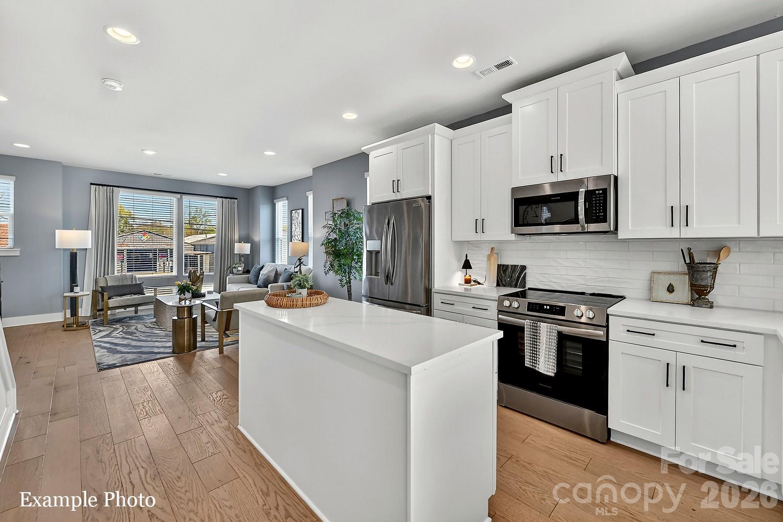 WOW! ROOFTOP TERRACE WITH CITY VIEWS, COMMUNITY DOG PARK AND CLOSE PROXIMITY TO UPTOWN BELOW $450K! Receive up to $20,000 in Flex Dollars! PREMIUM LOCATION JUST 2 BLOCKS TO CAMP NORTH END, LIVE IN A NEW, BEAUTIFULLY APPOINTED TOWNHOME! Discover Modern Industrial Living at "North End Terraces". A Unique Townhome Community of 69 Homes w/ Modern Design and Artful Architecture. Nestled between Charlotte's thriving Arts District, NODA, and the bustling Central Business District of Uptown. 

3 bedrooms, 2 full/2 half baths, 2 car attached garage WITH EV CHARGER. Upscale finishes including blonde LVP floors throughout main living area and upstairs hallway, plus oak tread staircases leading to main & second floors. Designer kitchen with white cabinets, quartz countertops, mist glossy watercolor backsplash, stainless steel appliances including range, dishwasher & microwave. Primary bath features a large, tiled walk-in-shower with basket weave tile wet-bed, modern black fixtures, tiled floors in all full baths and more! This home is not to be missed!

INVESTORS:NO RENTAL RESTRICTIONS.