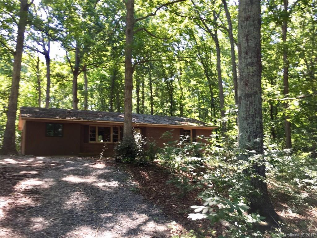 Extremely rare find ! Investors and Builders opportunity. 2 parcels combined, a 1 1/2 AC lot with Brick Ranch Home & a 1/2 AC building lot = 2 ACRES! Wooded Property, Mature Trees, located at the end of a quiet street. No HOA. Selling 2 parcels together. Two storage buildings to remain. Remove the trailer and build a new home & remoldel the brick ranch home. See sellers disclosure's. Life estate to be signed away at closing. Zero value placed on trailer. New Dobys Bridge Elem school 2 blks away