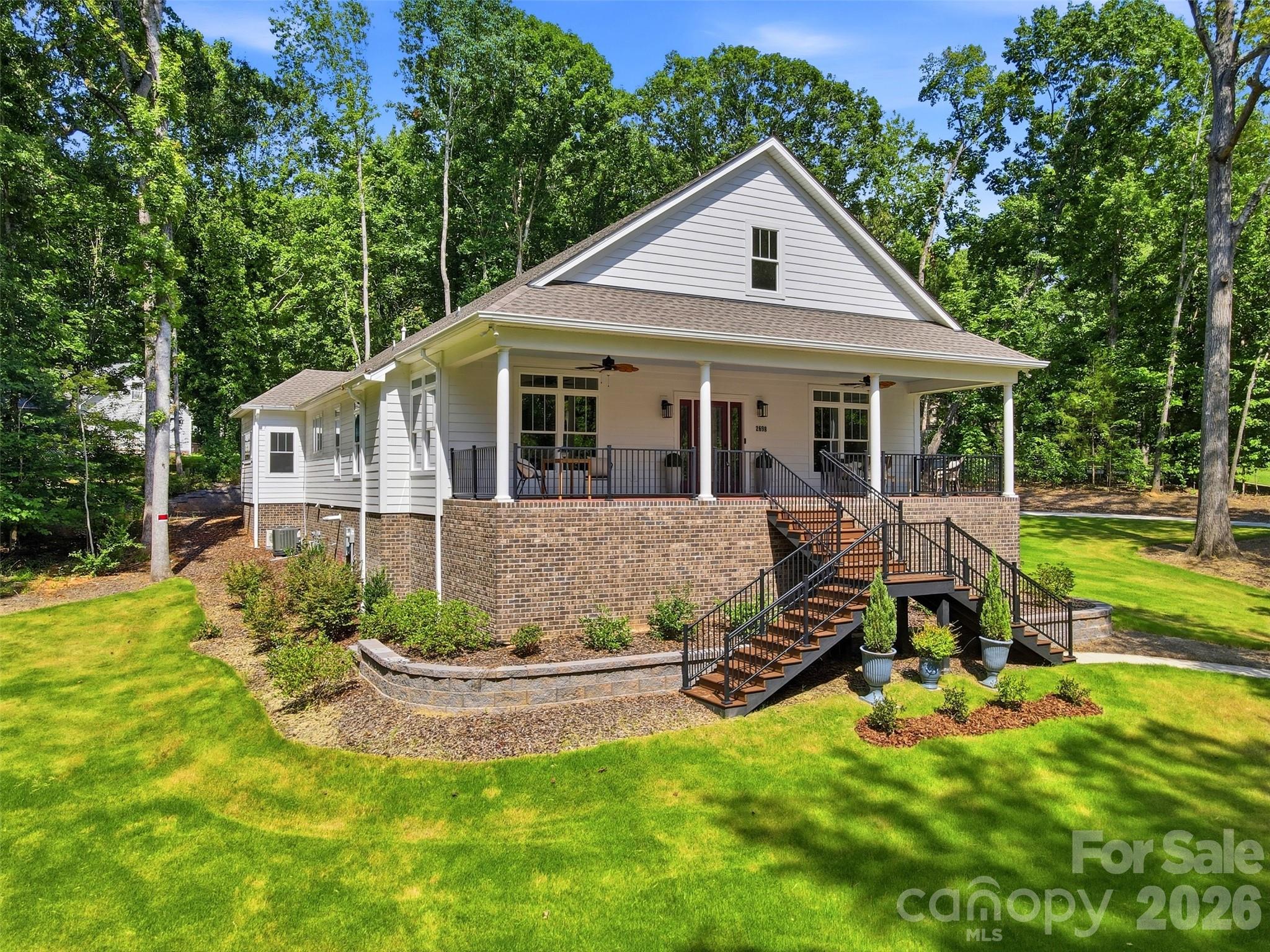This custom home in the desirable Oakhurst subdivision seamlessly combines thoughtful design, superior craftsmanship, and more than 3,300 square feet of finished living space. Built by the renowned Southern Builders, the home was recently completed with the addition of the former upstairs bonus room, creating a versatile finished space ideal for a fourth bedroom, media room, or home office.

High-quality finishes include hardwood floors, walnut trim, and custom moldings throughout. Nine-foot ceilings create an open, airy feel, while the primary suite features a soaring ten-foot ceiling that adds an extra touch of elegance.

The well-designed floor plan provides effortless flow between the living, dining, and kitchen areas, making it ideal for both everyday living and entertaining. The kitchen opens to a bright sunroom overlooking a fully sodded yard with in-ground irrigation, creating a seamless connection between indoor and outdoor living.

Designed with durability and efficiency in mind, the home features James Hardie siding, spray foam insulation, a tankless water heater, a Trex front porch, and a partially encapsulated crawlspace. Additional features include an oversized two-car garage, under-stair storage, and the newly finished upstairs bonus room.

The privately situated primary suite is complemented by two generously sized secondary bedrooms, offering flexibility for guests, family, or a home office. The washer, dryer, and refrigerator convey with the home, providing a truly move-in-ready opportunity. Combining exceptional craftsmanship, quality construction, and a thoughtfully designed layout, this home is a rare opportunity in one of the area's most desirable neighborhoods.