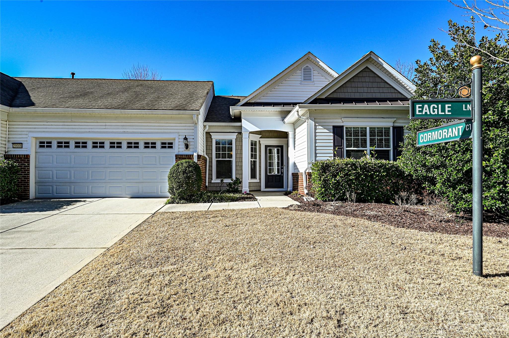 Welcome to your new home in amenity rich Sun City Carolina Lakes, a premier Del Webb community. This lovely end-unit villa offers privacy and easy access to community amenities and retail businesses. This home offers an eat-in kitchen, 2 bedrooms, 2 baths, sunny living room with w/formal dining, enclosed porch with EZ Breeze windows that opens onto a paver patio, and a 2 car garage. Primary bedroom offers an ensuite bath and glass enclosed shower. Great location!