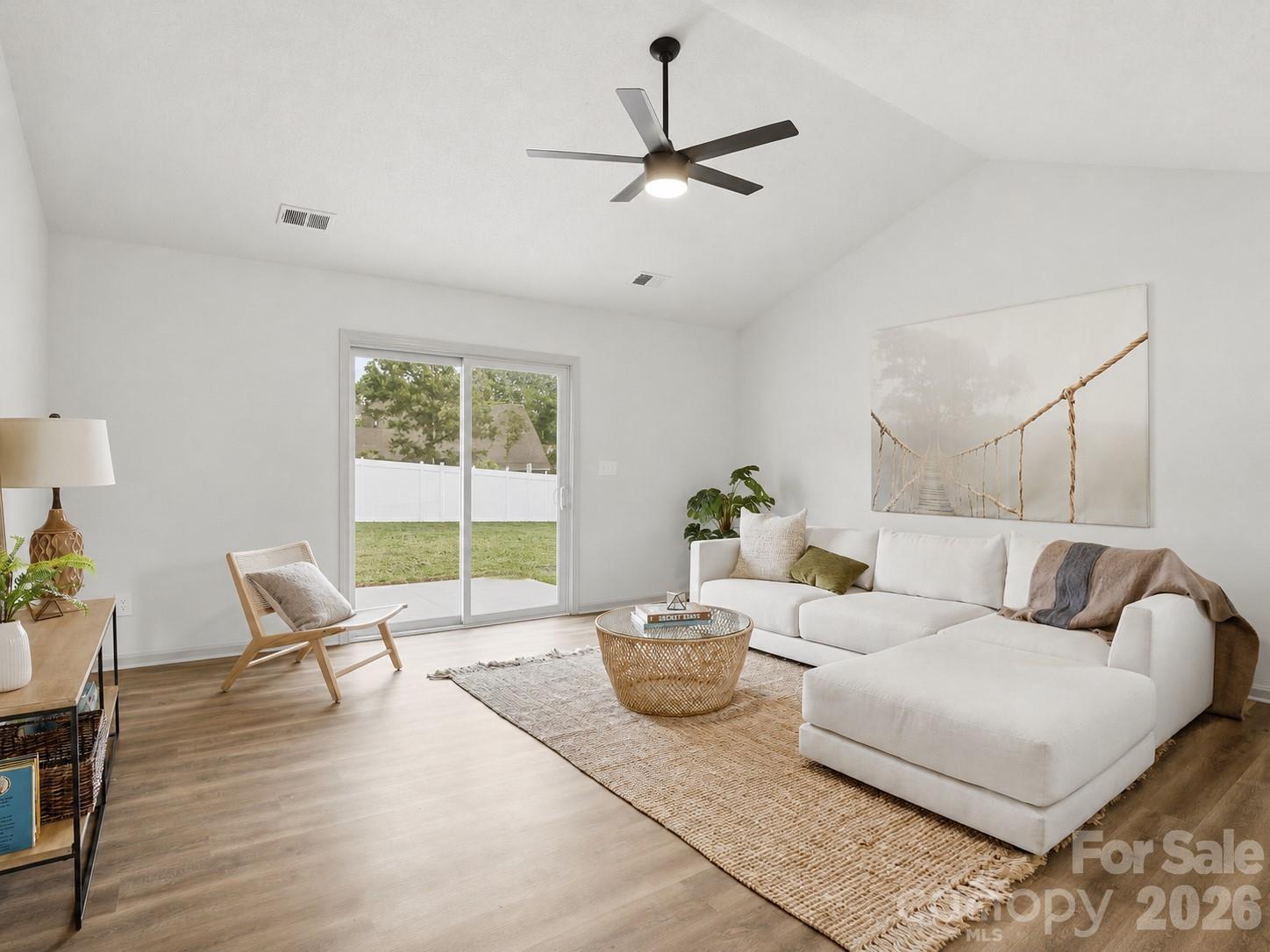 Updated, functional, and full of charm— This North Charlotte ranch offers the move-in ready, low-maintenance lifestyle buyers are searching for. Tucked away in a quiet neighborhood with NO HOA, this beautifully refreshed home features 3 bedrooms, 2 full bathrooms, and over 1,400 square feet of thoughtfully updated living space. Step inside to fresh paint, new LVP flooring, new carpet, modernized light fixtures, and a perfectly neutral color palette ready for your personal touch. Upon entry, the updated eat-in kitchen showcases freshly painted cabinets, quartz countertops, new stainless steel appliances, and upgraded hardware. A window over the sink opens into the family room, keeping the layout connected and functional. The spacious main living area features vaulted ceilings and an abundance of natural light, creating an open and inviting feel. Down the hall, the primary suite also offers vaulted ceilings, making the space feel even more elevated. The updated en-suite bathroom includes a freshly painted vanity, new hardware, and a walk-in shower with sliding glass door. Two generously sized secondary bedrooms provide flexibility for guests or a home office-- Plus share their own updated full bathroom. Double doors from the family room lead to a concrete patio and a large, flat, fully fenced backyard to enjoy NC weather year-round. Fresh landscaping, including new mulch and bushes, adds curb appeal and a welcoming first impression. New HVAC installed in 2026 adds peace of mind for years to come. Tucked in a convenient North Charlotte location, this home offers easy access to I-77 and I-485 for commuting to Uptown Charlotte. Enjoy close proximity to Northlake Mall and AMC for shopping, dining, and entertainment, plus nearby outdoor recreation at Nevin Community Park featuring athletic fields, playgrounds, and a disc golf course. For the buyer who values the freedom of no HOA, privacy, upgraded finishes, and everyday convenience, this home truly hits the mark in every way. HUGE BUYER INCENTIVE: Through preferred lender, this property qualifies for 100% financing, no PMI, $5000 grant towards closing costs, and $5000 towards down payment assistance! Contact listing agent for details.
