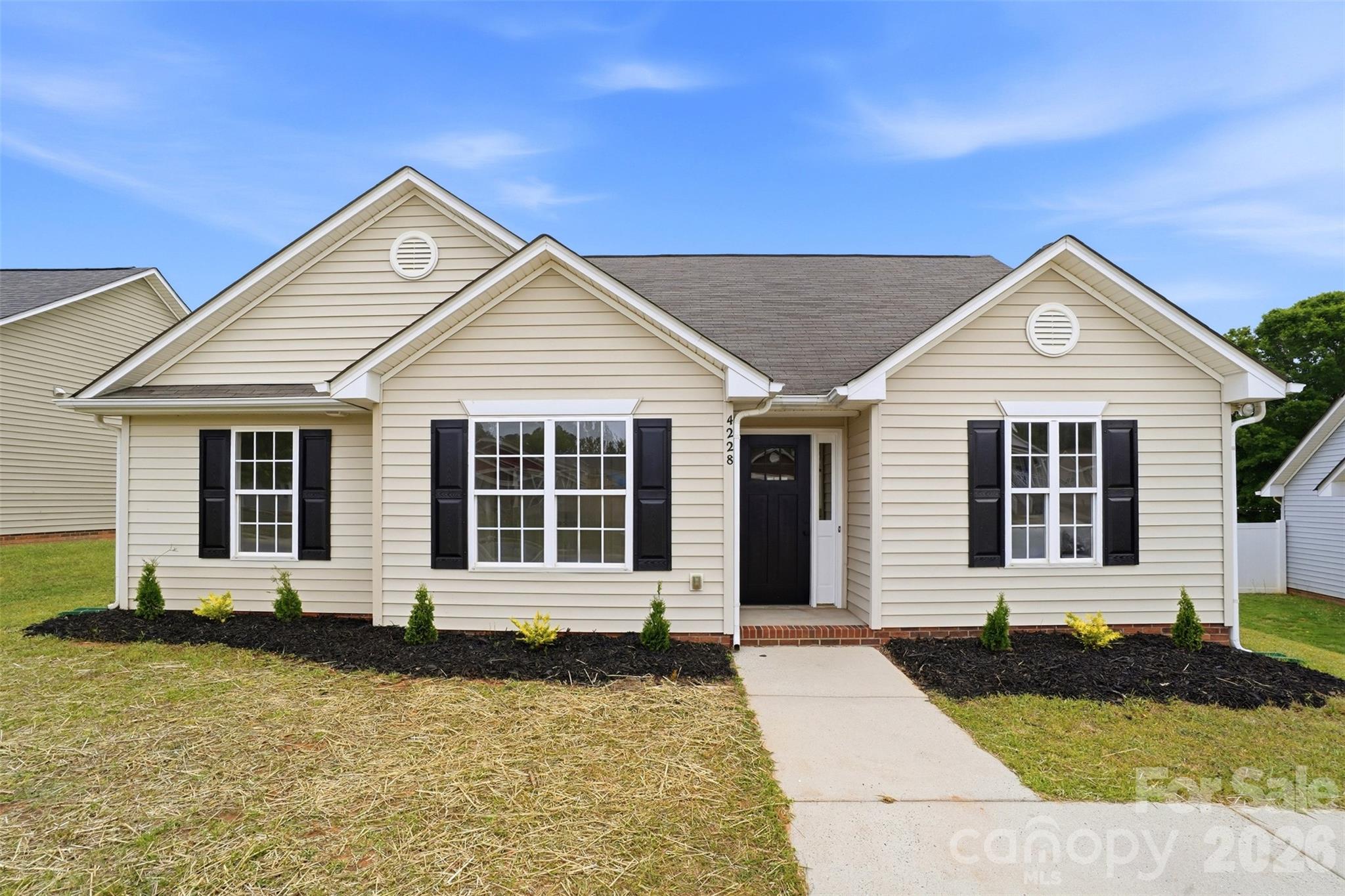 Updated, functional, and full of charm— This North Charlotte ranch offers the move-in ready, low-maintenance lifestyle buyers are searching for. Tucked away in a quiet neighborhood with NO HOA, this beautifully refreshed home features 3 bedrooms, 2 full bathrooms, and over 1,400 square feet of thoughtfully updated living space. Step inside to fresh paint, new LVP flooring, new carpet, modernized light fixtures, and a perfectly neutral color palette ready for your personal touch. Upon entry, the updated eat-in kitchen showcases freshly painted cabinets, quartz countertops, new stainless steel appliances, and upgraded hardware. A window over the sink opens into the family room, keeping the layout connected and functional. The spacious main living area features vaulted ceilings and an abundance of natural light, creating an open and inviting feel. Down the hall, the primary suite also offers vaulted ceilings, making the space feel even more elevated. The updated en-suite bathroom includes a freshly painted vanity, new hardware, and a walk-in shower with sliding glass door. Two generously sized secondary bedrooms provide flexibility for guests or a home office-- Plus share their own updated full bathroom. Double doors from the family room lead to a concrete patio and a large, flat, fully fenced backyard to enjoy NC weather year-round. Fresh landscaping, including new mulch and bushes, adds curb appeal and a welcoming first impression. New HVAC installed in 2026 adds peace of mind for years to come. Tucked in a convenient North Charlotte location, this home offers easy access to I-77 and I-485 for commuting to Uptown Charlotte. Enjoy close proximity to Northlake Mall and AMC for shopping, dining, and entertainment, plus nearby outdoor recreation at Nevin Community Park featuring athletic fields, playgrounds, and a disc golf course. For the buyer who values the freedom of no HOA, privacy, upgraded finishes, and everyday convenience, this home truly hits the mark in every way. HUGE BUYER INCENTIVE: Through preferred lender, this property qualifies for 100% financing, no PMI, $5000 grant towards closing costs, and $5000 towards down payment assistance! Contact listing agent for details.