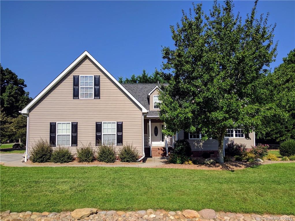 Welcome home to beautiful Henry's Orchard where you'll be able to enjoy your privacy in the shade of the trees as if you were living on a quiet country road. Step inside to take in a cozy living room guiding you either into the gourmet kitchen with gorgeous granite or out to the spacious sunroom where you can relax with a glass of sweet tea. With gleaming wood flooring throughout and easy main-level living, you'll feel right at home the moment you walk through the door. Don't let it get away!