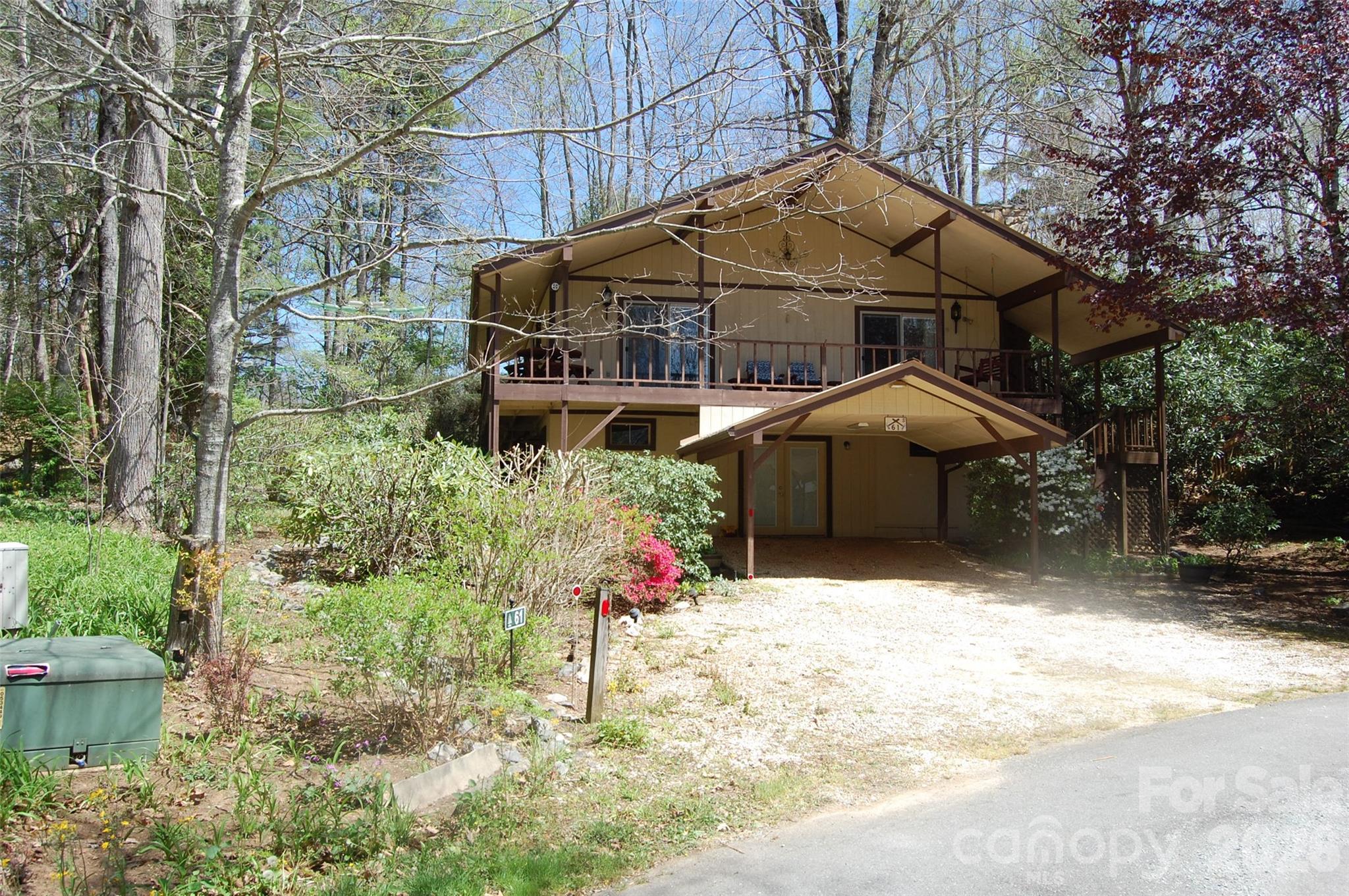 Mountain Cottage in the resort community of Linville Land Harbor. This two bedroom, two bath home is
located in a homes only section with a quick five minute golf cart ride to Land Harbor's recreation center,
swimming pool, lake and trails. With two street access, you have plenty of parking options. Large
covered porch and nicely landscaped grounds. Upper level great room with large Linville stone gas
fireplace and vaulted ceilings. Two bedrooms each with ensuite bath. Lower level is finished and has
been used for overflow sleeping, laundry, trout cleaning station, den....so many possibilities going
forward! Generator in place. Land Harbor annual POA fees include water, sewer, trash pick-up, internet
and cable TV as well as common area and road maintenance. This well loved family home for over 30
years is now available for you to make your own mountain getaway a dream come true!!