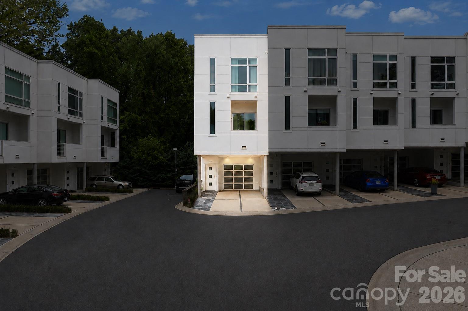 This three-level condo in Celadon gives you room to spread out without the upkeep of a full yard. The main floor opens up the way you'd want it to: a great room that runs into the kitchen and breakfast room, with a half bath set off to the side for guests. You can cook, eat, and spend the evening together without anyone stuck in a separate room.
Upstairs, both bedrooms have their own full bath, so nobody's waiting on the shower on a workday morning. The garage on the lower level keeps your car covered and gets you inside dry when it's raining.
Outside, you're under the mature tree canopy that Wesley Heights is known for, the kind of old hardwoods that actually shade the street in summer. Celadon also connects directly to the greenway, so you can jump on the trail, in seconds. That same greenway runs toward Savona Mill, where Savona Food Works is slated to open in 2027 with roughly 25 food stalls, a full-service restaurant and bar, a coffee shop, and a rooftop bar. And you also have excellent nearby food/brewery options that are already established like Town Brewing, Rhino Market, Restaurant Constance, Noble Smoke, and Bossy Beulah's, to name a few. 
You're a few minutes from Uptown on a quieter, tree-lined edge of it. Come see the layout in person and how it actually lives.