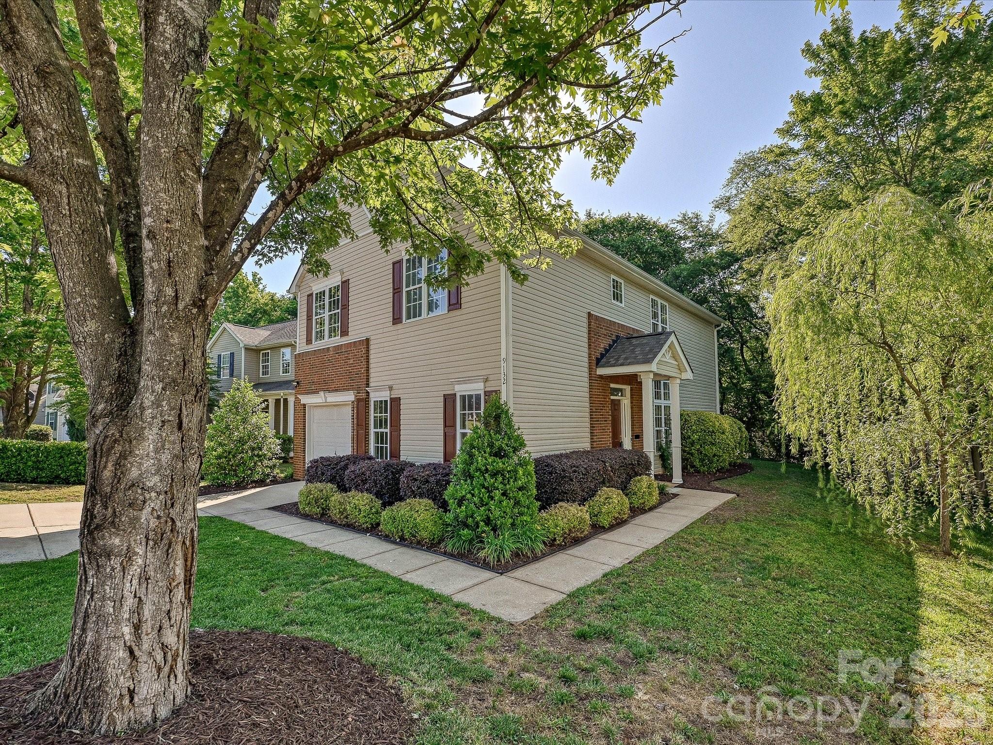 Move-in ready, freshly painted and updated charming home in highly sought-after Southampton. A soaring two-story dining room welcomes you with refreshed lighting and ALL-NEW, low-maintenance Luxury Vinyl Plank flooring that flows throughout the entire first level. Tucked on a beautifully wooded homesite, the home enjoys an impressive amount of natural light through its many windows. A spacious formal living room, open great room and kitchen offer generous gathering space, featuring Gas Fireplace, a large center island with breakfast seating, stainless steel appliances including a NEW Electric Range, a single basin 'Farm' sink, and NEW quartz countertops. Upstairs, the gracious open staircase leads to double doors opening into a primary suite with vaulted ceiling, private bath, and a roomy walk-in closet. Ceramic flooring plus new Brushed Nickle faucets and coordinating lighting highlight both 2nd-level baths. The laundry room is also on the 2nd level for optimal convenience, with both washer and dryer included! Southampton amenities include a pool, sports courts, playground, and clubhouse. Districted to popular, high-performing schools including Knights View Elementary, Community House Middle, and Ardrey Kell High. Minutes to South Charlotte dining and entertainment at Ballantyne, The Bowl and Blakeney.  Enjoy outdoor concerts at the AMP, or shopping local at Ballantyne Village. So much to see and do...or just retreat to this turn key home.