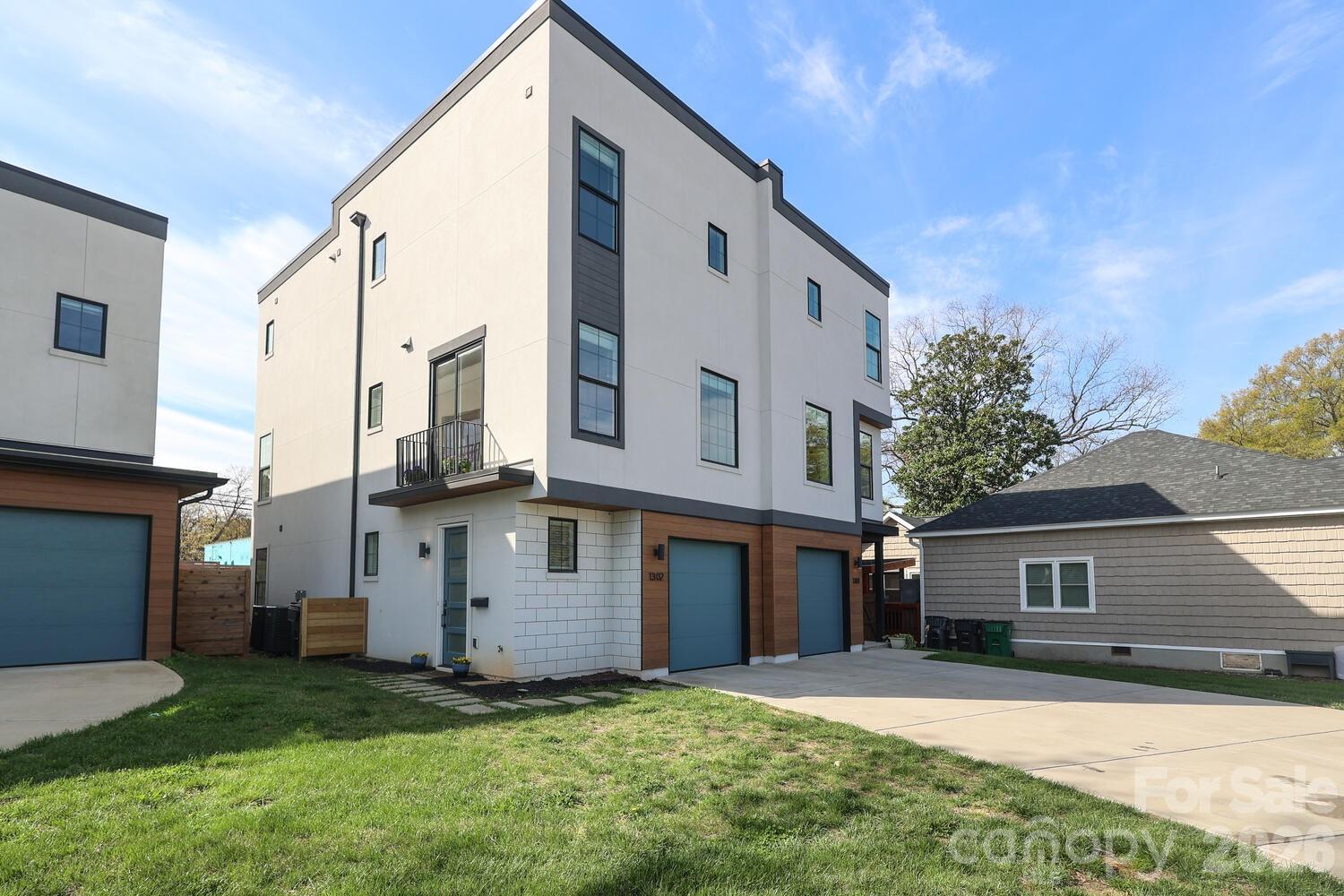 Stylish and low-maintenance, this 3-bedroom townhome offers the ideal blend of comfort and city living—with each bedroom featuring its own en suite bath, plus a convenient half bath for guests. Built in 2022, the light-filled open floorplan creates an easy, modern flow perfect for both everyday living and entertaining.

Enjoy skyline views of Charlotte from your private rooftop 330 sf deck—an ideal spot to unwind. Home features an attached one car garage wired for an EV charger, driveway parking and additional rear parking. Washer, dryer, and refrigerator all convey.

Located just moments from Commonwealth and the heart of Plaza Midwood, you’ll love the easy access to some of Charlotte’s best dining, shopping, and entertainment.