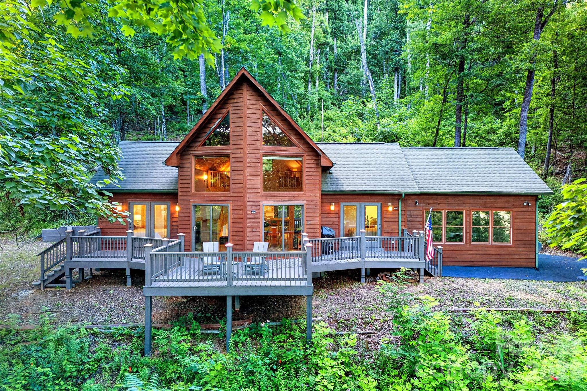 **A-Frame Mountain Retreat on 10+/- Acres — Gated Community, Turnkey & Rental-Ready**

Escape to the mountains without sacrificing convenience. This beautifully updated A-frame sits on 10+/- private acres just minutes from Old Fort, Black Mountain, and I-40 — offering the perfect blend of seclusion and accessibility. Additional building sites with paved road access make this a rare opportunity for future expansion or investment.

**Inside:** Main-floor living makes everyday life easy, while the spacious great room — anchored by a cozy fireplace and floor-to-ceiling windows — frames uninterrupted mountain views as well as tongue and groove ceilings . French doors from both bedrooms open onto an expansive deck, blurring the line between indoor comfort and outdoor beauty. Escape to the loft you can use as reading area, office or even a guest bedroom. Both bathrooms have recently been updated. hardwood floors in the great room and new carpet in the bedrooms and loft area. Mountain views greet you in the great room and from the amazing deck. 

**A Standout Bonus:** The fully remodeled garage doubles as a stunning covered recreation space — just raise the door and let the mountain air in. Perfect for entertaining, a home gym, or a creative studio. Or easily turn into heated square footage.

**The Community:** Located in Gateway Mountain, a thriving gated community spanning 3,000+ acres and bordering a 12,000-acre conservatory along the Hickory Nut Mountain range. Residents enjoy scenic ponds, cascading waterfalls, and picnic areas — with trails to Old Fort just beyond the gates. This home currently has hi-speed fiber optic with Starlink as a backup. Working from home is easy from here. Enjoy the community TGIF events on every Friday evening at Lake George from April to October. Very active community with several full time residents. 

**The Opportunity:** Sold turnkey and ready for immediate use — whether as a full-time residence, weekend getaway, or income-producing rental. Short-term rentals are permitted, and with peak Fall Leaf season approaching, this home is primed to start generating revenue right away.  PS This home has a 3 bedroom septic making adding heated space for an additional bedroom (for example the attached garage) easy!

**Private. Polished. Profitable. Schedule your showing today — homes like this in Gateway Mountain don't come along often.**