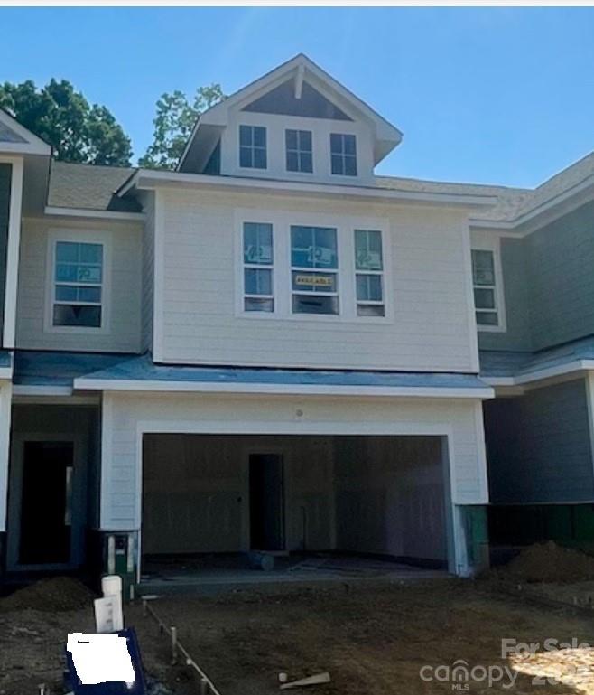Discover the ease of low-maintenance living in this brand-new Thornhurst II townhome, just minutes from the charming shops, restaurants, and vibrant atmosphere of historic downtown Waxhaw! Embrace a lock-and-leave lifestyle with included lawn care, giving you more time to explore or relax in your private backyard. Spend weekends enjoying unique boutiques and local events, knowing your yard is maintained. Your backyard is a peaceful retreat with views of gorgeous trees and natural areas. This spacious home features an open, bright floor plan—perfect for entertaining or unwinding. The modern kitchen includes sleek quartz countertops and a large island overlooking your covered porch. After a long day, relax in the luxurious Owner's Retreat with an oversized walk-in closet. A side-by-side two-car garage and full driveway offer ample parking.