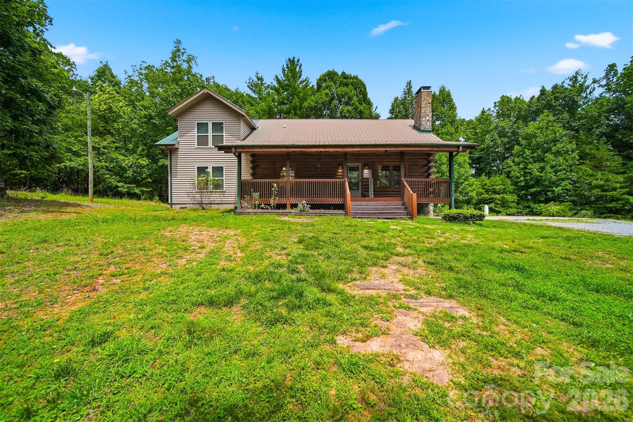 Back on the market, no fault of seller! Tucked away in the scenic foothills, located in the sought after Dudley Shoals area, this beautifully maintained log home on almost 7 acres offers rustic charm and room to grow. Wake up to serene mornings on your rocking chair front porch sipping coffee as birdsong and gentle breezes welcome the day with natures beauty unfolding right before you. Inside, you’ll find a spacious, functional layout with an inviting main living area that flows seamlessly into the kitchen and dining space, ideal for both everyday living and entertaining. The kitchen has been updated with new stainless steel appliances, offering a clean, modern contrast to the warmth of the natural wood interior, plenty of storage and a breakfast bar that provides additional seating. Enjoy winter evenings gathered around the rustic stone fireplace with the new wood stove insert (Regency) in the living room. Upstairs offers a large family room, full bathroom and two additional bedrooms with a 4th room currently being used as a home gym. Primary suite on main level with his and hers walk-in closets, a large garden tub, tiled walk-in shower, and dual vanities. Step out back on the large deck to enjoy the fenced-in backyard, perfect for pets, play, or simply relaxing in your own private outdoor space. The logs were professionally refinished in 2022 providing long term durability. Surrounded by the natural beauty of Western North Carolina, this property offers the peace and privacy buyers are looking for while still being conveniently located to Lenoir, Hickory, and the High Country. This home is full of character—and one you don’t want to miss.