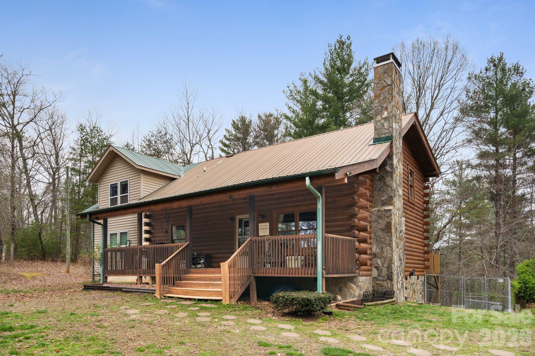 Back on the market, no fault of seller! Tucked away in the scenic foothills, located in the sought after Dudley Shoals area, this beautifully maintained log home on almost 7 acres offers rustic charm and room to grow. Wake up to serene mornings on your rocking chair front porch sipping coffee as birdsong and gentle breezes welcome the day with natures beauty unfolding right before you. Inside, you’ll find a spacious, functional layout with an inviting main living area that flows seamlessly into the kitchen and dining space, ideal for both everyday living and entertaining. The kitchen has been updated with new stainless steel appliances, offering a clean, modern contrast to the warmth of the natural wood interior, plenty of storage and a breakfast bar that provides additional seating. Enjoy winter evenings gathered around the rustic stone fireplace with the new wood stove insert (Regency) in the living room. Upstairs offers a large family room, full bathroom and two additional bedrooms with a 4th room currently being used as a home gym. Primary suite on main level with his and hers walk-in closets, a large garden tub, tiled walk-in shower, and dual vanities. Step out back on the large deck to enjoy the fenced-in backyard, perfect for pets, play, or simply relaxing in your own private outdoor space. The logs were professionally refinished in 2022 providing long term durability. Surrounded by the natural beauty of Western North Carolina, this property offers the peace and privacy buyers are looking for while still being conveniently located to Lenoir, Hickory, and the High Country. This home is full of character—and one you don’t want to miss.