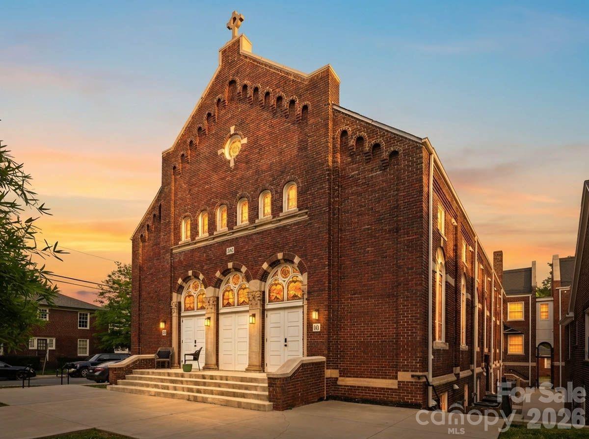 A truly rare opportunity to own one of the most architecturally distinctive residences within The Arches—a boutique collection set inside a meticulously restored 1927 church in the heart of Wesley Heights. Unit 9 showcases some of the most coveted original elements of the building, including stained-glass windows and a dramatic wood vaulted ceiling, seamlessly blending historic character with refined, modern living. Originally constructed as a place of gathering and community, the building has been thoughtfully transformed while preserving its historic integrity and timeless presence. This residence offers a private entrance, creating a sense of individuality and privacy that is rarely found in condominium living. Inside, the main living space is both striking and inviting, defined by soaring ceilings, architectural detail, and abundant natural light filtering through the original stained glass. The open-concept layout flows effortlessly into a beautifully designed kitchen featuring quartz countertops, stainless steel appliances, subway tile backsplash, pendant lighting, and modern cabinetry, offering both functionality and elevated design. Spa-inspired bathrooms include porcelain tile shower walls and floors, complemented by clean, contemporary finishes throughout. The thoughtful layout balances historic charm with modern convenience, creating a unique and highly livable space. Additional highlights include deeded parking space available for purchase. Designed for a low-maintenance, lock-and-leave lifestyle, this residence is ideally positioned just minutes from Uptown Charlotte, with easy access to South End, I-77, greenways, and some of the city’s best restaurants, breweries, coffee shops, and entertainment. Walk, bike, or take advantage of nearby transit options to fully experience the vibrancy of Wesley Heights and the surrounding areas. This is more than a home—it’s a one-of-a-kind living experience that captures the essence of Charlotte’s history while delivering the style, comfort, and convenience of modern urban living.