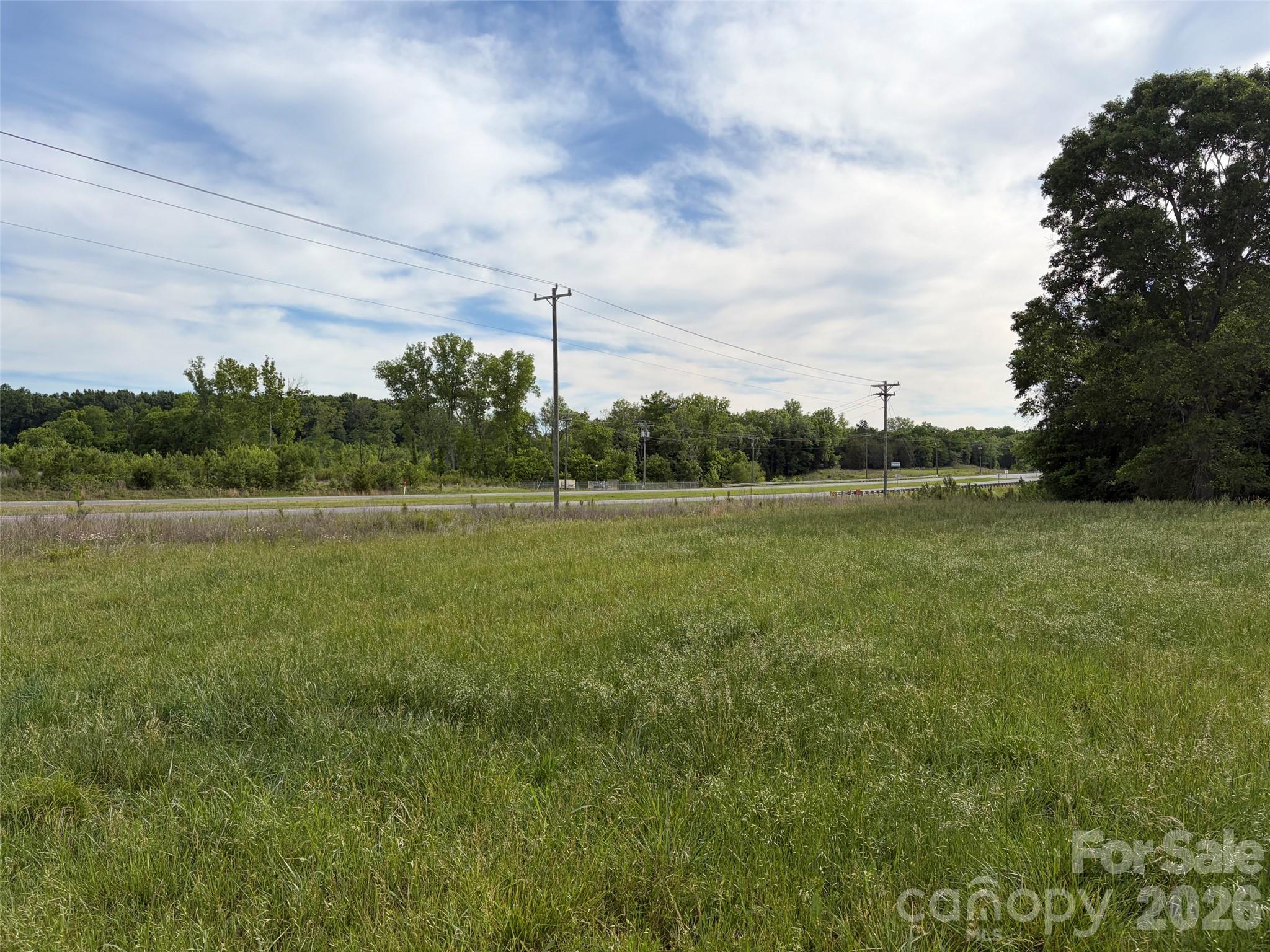 ±59 acres zoned ID-2 with ±1100' of frontage on Lancaster Highway(SC Hwy 9) located approximately halfway between Richburg and Chester in Chester County. Property is less than 6 mile from I-77 (Exit 65) and near several industrial sites along Highway 9. Access to county water and sewer, the site delivers excellent visibility and infrastructure advantages. A mix of open pasture and wooded areas on level terrain making it suitable for many uses. From industrial to a private homestead, this property has tons of opportunity. Conveniently located to Charlotte, Rock Hill, Lancaster, Chester, and Columbia; and within 6 minutes I-77 SC Exit 65 Richburg, SC where many public amenities are located