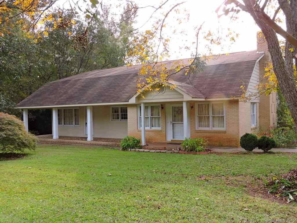NEW ROOF Feb 2016. Lrg home w/ auto shop + 5ac in the country. Sold AS IS. Orig 1940s 4 room home expanded in 1975 4 times original size. Huge family room w wood burning insert in FP. 2 Kitchens. Unfinished space upstairs includes bonus room, 2 additional rms, balcony, lots of attic space. Automotive shop with 2 bays, 2 outside lifts, sep paint shop, lots of covered storage space. New detached carport w/ concrete drive/floor. Almost new detached storage building.