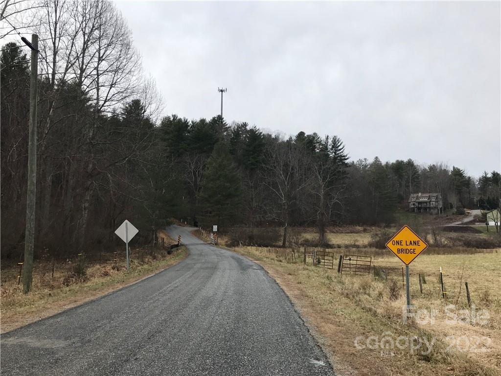 6+/- acres of a 6.35 acre lot. The acreage is wooded  with great building sites. Many beautiful homes next to the acreage with city water line on the edge of the property.  A cell tower is located on the property. 
Whereby the tower company has 30 days to review any proposed contract for
the sale of the property."The Property is subject to a lease for the existing cell tower, covering
10,000 sq.ft. (0.229 Ac) and a 30 foot wide access easement, as specifically
set forth in a Memorandum of Lease recorded in Book 2785, beginning on Page
161 of the records maintained by the Office of the Register of Deeds for
Buncombe County.  The Property is also subject to a Right of First Refusal
retained by the cell tower tenant that includes a 30 day notice term." There is no Revenue from the leased tower, already paid out. The cell tower goes with the property.