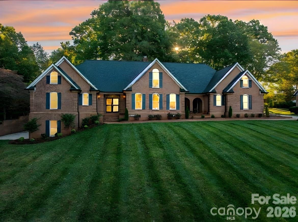 Public Remarks 
AGENT IS OWNER NOW PRICED ALMOST $200,000 BELOW RECENT APPRAISED VALUE.  This is now a “As Is” sale. Welcome to this elegant all-brick estate on the edge of Downtown Lincolnton, offering nearly 6,000 square feet of beautifully designed living space. Every detail reflects timeless craftsmanship, from the intricate crown and dental moldings throughout the home to the 20-foot vaulted ceilings that create an atmosphere of grandeur in the living room. The kitchen, featuring granite countertops, new appliances, and an unbelievable amount of cabinet space will certainly be welcomed. On the main level, you’ll find two luxurious primary suites, each with updated bathrooms, along with a sunroom that’s both heated and cooled l, perfect for enjoying year-round comfort or a gentle breeze on warm Carolina days. Upstairs, three additional bedrooms and two full baths provide comfort and privacy for family or guests. Over the garage, a versatile bonus suite, accessible from both the garage and the main house, offers endless possibilities: a guest retreat, home office, or recreation space. The finished basement extends your living area even further, featuring a spacious recreation room with rough-in plumbing for a wet bar, and an adjoining room ideal for a home gym, studio, or workshop. Blending classic architecture with modern updates, this remarkable home offers space, style, and flexibility, all within minutes of Lincolnton’s vibrant downtown.