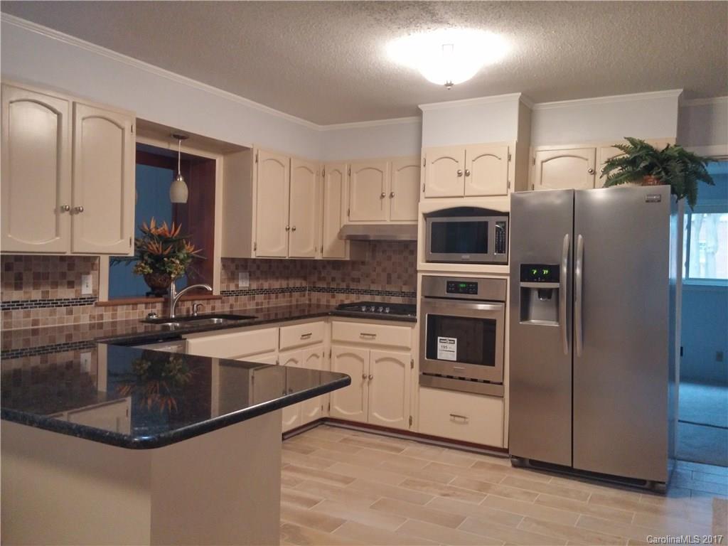 Gorgeous Brick Ranch 3 bedroom, 2 1/2 bath with a bonus room could be the fourth bedroom.  New neutral paint , new stainless steel appliances, wall oven, granite kitchen counter top, new carpet family room and bonus room, new tile floor in kitchen and bathrooms, refinish hardwood floor living room and all bedrooms.  Double vanity with  granite counter top in hall bath with custom design wall tile.  New 4 tons Carrier Heat & AC gas pack.  Convenience to I-77, shopping, dinning.  Moved in ready...