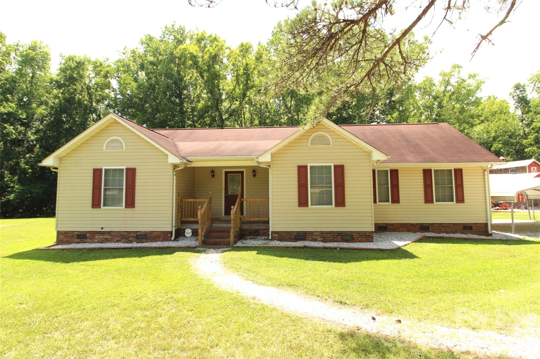 Welcome Home! Nice, Vinyl-sided, Ranch Style Home located on 2.519+/- Acres in Clover School District. This home has 3 Bedrooms and 2 Bathrooms with approximately 1538 Heated Square Feet. Detached Carport, New carpet has recently been installed.  Formal Dining room features hardwood flooring and chair railing.  Galley style Kitchen featuring Oak cabinets, Oak Shelving and Built-in Desk. Large Great room has vaulted ceiling, ceiling fan and some hardwood flooring at the entry. Split Bedroom Plan. Primary bedroom has vaulted ceiling, ceiling fan and walk-in closet. Primary Bathroom features double sinks, oak cabinets, and garden tub/shower combination.  Covered front porch and rear deck for outdoor enjoyment. No HOA!   Schedule your appointment to view this home today!