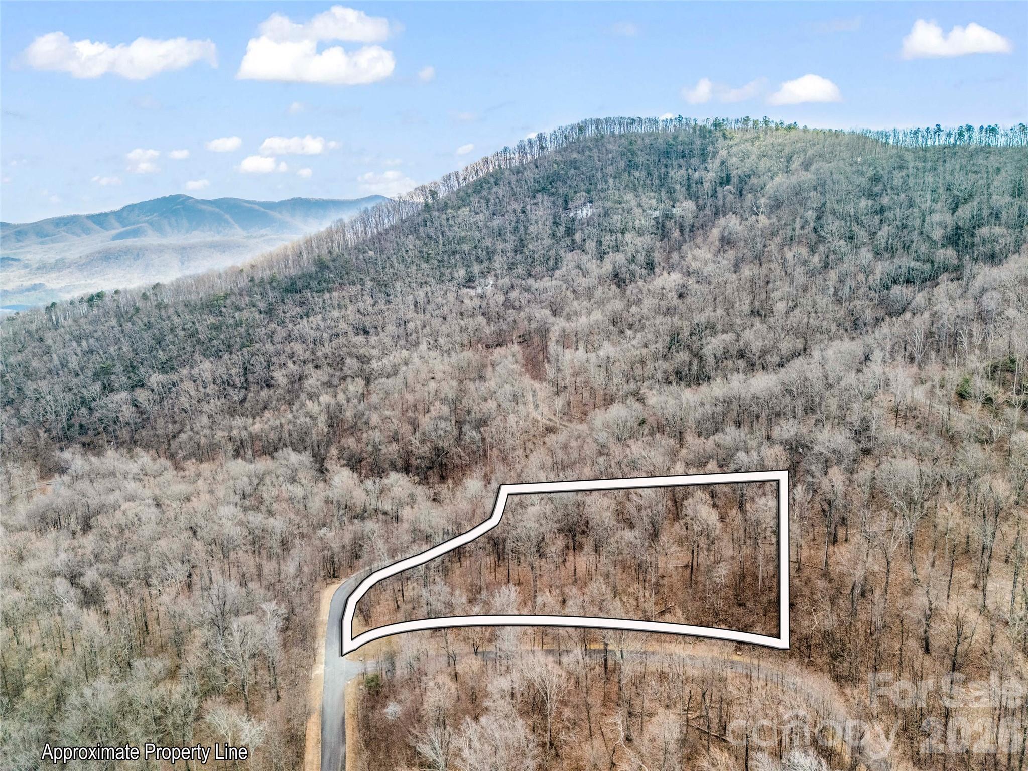 Lot 2128 has gentle build site and great location within Brights Creek. Brights Creek is a beautiful development with paved roads, fiber optic, water, sewer, & natural gas. Community offers 24 hour staffed greeters cottage and many scenic walking trails including a waterfall trail. Brights Creek Club offers a 19 hole Tom Fazio championship golf course, tennis/pickleball, and mountain lodge with restaurant and bar. Amenity area features an outdoor heated saline pool, two lane bowling, fitness, casual dining, and many beautiful gathering spaces with a huge stone fireplace and full bar. Make an appointment to experience Bright's Creek today.