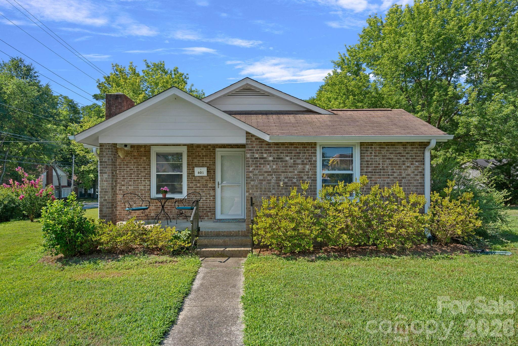 Thoughtfully updated while preserving its classic charm, this inviting brick cottage is move-in ready and full of quality improvements. Major system updates include a rewired electrical system, updated electrical panel, and replaced sewer line, providing lasting peace of mind. The remodeled kitchen serves as the centerpiece of the home with custom cabinetry, updated countertops, a center island, and a newer dishwasher. New flooring, fresh interior paint, and crown molding create a cohesive, updated feel throughout, while new blinds have been added in the bedroom and office. The flexible floor plan offers two bedrooms. An updated bathroom and convenient laundry area complete the interior. Situated on a spacious corner lot, the property also features a detached wired workshop with added shelving and lighting, offering exceptional storage and workspace, along with a covered carport/shed. Located just minutes from downtown Dallas, this home combines small-town charm with thoughtful updates and everyday functionality.