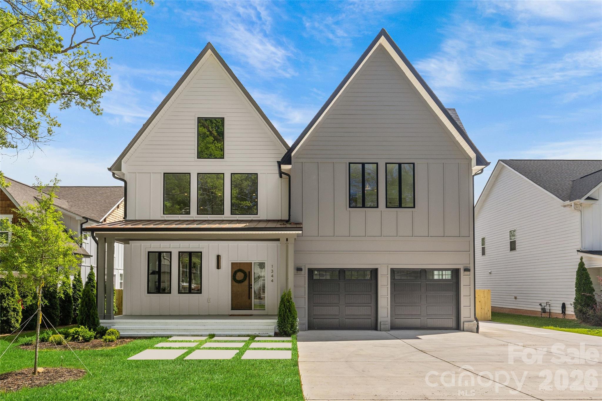 Welcome to this gorgeous newly constructed home in the Cotswold area of Charlotte. From the moment you step inside, you’re greeted by a dramatic two-story open living space filled with natural light, seamlessly flowing into a sleek, contemporary kitchen—perfect for both everyday living and entertaining. The chef’s kitchen is a true centerpiece, featuring elegant quartz countertops, a show-stopping waterfall island, gas range, and a full suite of stainless steel appliances. The open layout creates an effortless connection between the kitchen, dining, and living areas. With 5 spacious bedrooms and 4.5 beautifully appointed bathrooms, this home offers flexibility for guests, home offices, or multi-generational living. The primary suite is a private retreat, complete with a spa-inspired bathroom boasting a zero-entry walk-in shower, a luxurious soaking tub, and generous space to unwind. The downstairs guest suite is well-appointed and could also serve as a primary suite. Step outside to enjoy a large, fully fenced backyard—ideal for gatherings, pets, or play. A spacious deck overlooks the yard, offering the perfect setting for outdoor dining, morning coffee, or evening relaxation. This home has light filled spaces in every room and finishes that the most discerning buyers are looking for from custom closets to showers with zero-entry and frameless glass, tankless water heater, fully fenced yard, high ceilings and a loft space overlooking the main living area that has a stunning glass railing. This is a fantastic opportunity to get into the booming Cotswold / "Oakwold" area, where many new builds are priced well-above this!