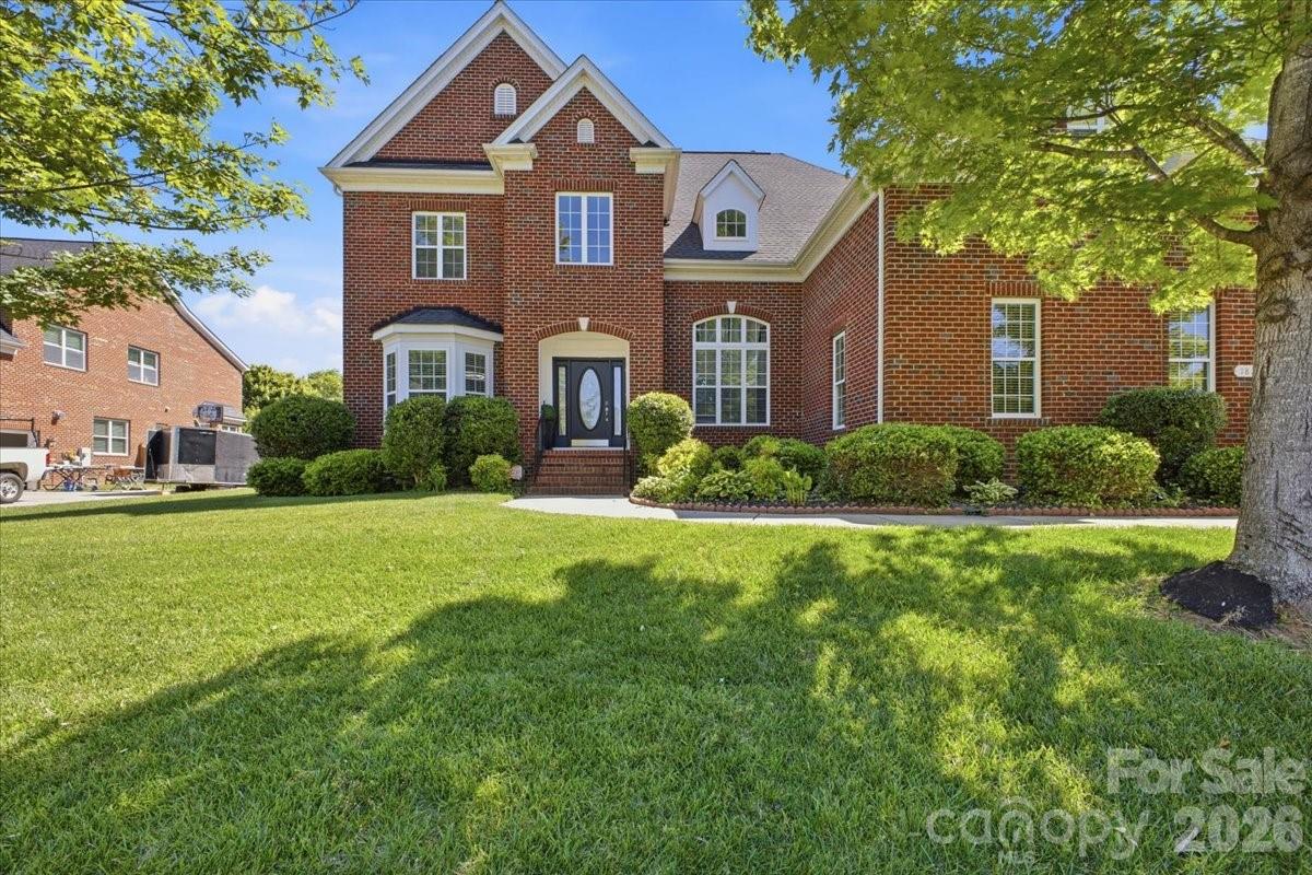 This Highland Creek home checks the boxes for space, flexibility, upgrades, and lifestyle. Offering 3,440 square feet with 5 bedrooms and 4 full bathrooms, the floor plan includes a main-level bedroom and full bath, a dedicated main-level office, and multiple living areas designed for everyday convenience and entertaining.

The kitchen features white cabinetry, granite countertops, a wine cooler, and an open connection to the main living spaces. Upstairs, the primary suite offers a tray ceiling, walk-in closets, soaking tub, and separate shower. One of the bedrooms is currently designed as a spacious home theater, creating a memorable entertainment feature with nearby bathroom access and storage.

The outdoor space adds another major highlight. Enjoy a covered composite deck, backyard TV/speaker setup, sprinkler system, retaining wall, and multiple fruit trees, creating an inviting setting for outdoor dining, gatherings, or quiet evenings. Inside, surround sound in the living room and game/media areas adds to the home’s entertainment-ready feel. The side-entry 3-car garage with epoxy flooring provides excellent space for vehicles, storage, hobbies, or fitness use.

Highland Creek is known for its extensive amenities, including 4 pools, parks/playgrounds, 2 clubhouses, fitness center, tennis/pickleball courts, fishing areas, walking trails, and community events. Nearby public golf and sports club amenities add to the area’s appeal. The location offers convenient access to shopping, dining, Concord Mills, and major routes including I-85 and I-485. With its spacious layout, entertainment-ready features, outdoor living, and amenity-rich setting, this home is a strong opportunity in Highland Creek.