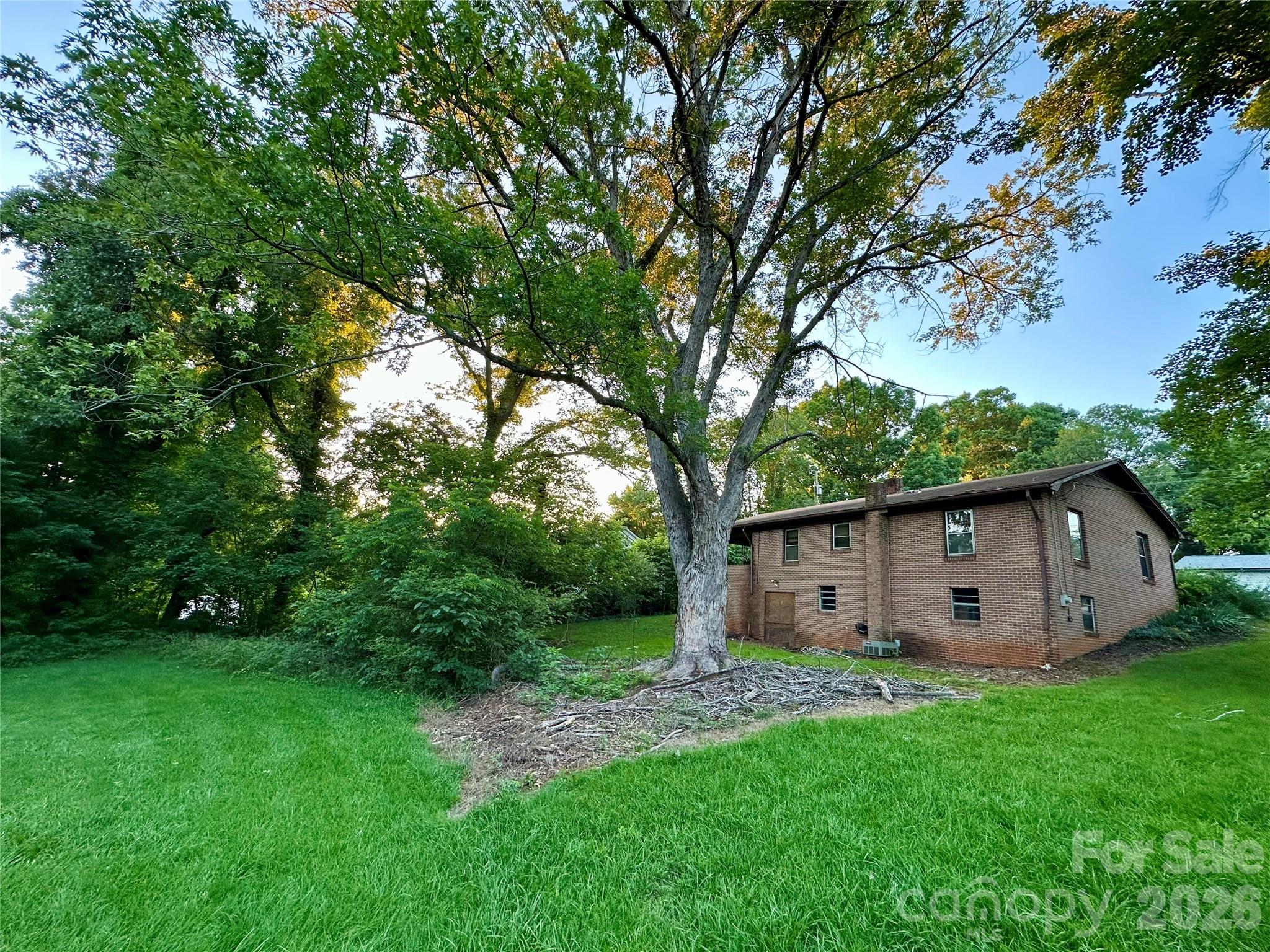 Brick ranch opportunity in a prime Morganton location. Welcome to 107 Conley St: a solid, well-built home just minutes from I-40 (Exit 103) and close to restaurants, shopping, and Western Piedmont Community College. This is the kind of “location + lot + bones” combination buyers look for when they want upside.

Inside, the home offers a practical layout ready for your updates. The property was thoughtfully adapted for wheelchair accessibility with wider doorways, more spacious bathrooms, and lower kitchen cabinetry. That is a real advantage for buyers seeking accessibility features and a strong starting point for anyone planning a renovation.

Downstairs, the basement is accessed only from the exterior: either down the carport stairs or through the separate exterior entry. The basement needs clean-out, but the separate outside access is a plus for investors and DIY buyers who want storage, workshop space, or a clean slate to improve without disrupting the main living area.

Yes, it needs work: the home is outdated, the driveway is cracked, and the basement needs cleaning. But the upside is clear: a brick home in a highly convenient corridor, priced to move, and ready for your vision.

Cash buyers only. Property is being sold as-is and is not expected to qualify for traditional financing. Ideal for a flip, rental, or an owner-occupant ready to renovate and build equity.

Offered at $139,900: schedule your showing today.