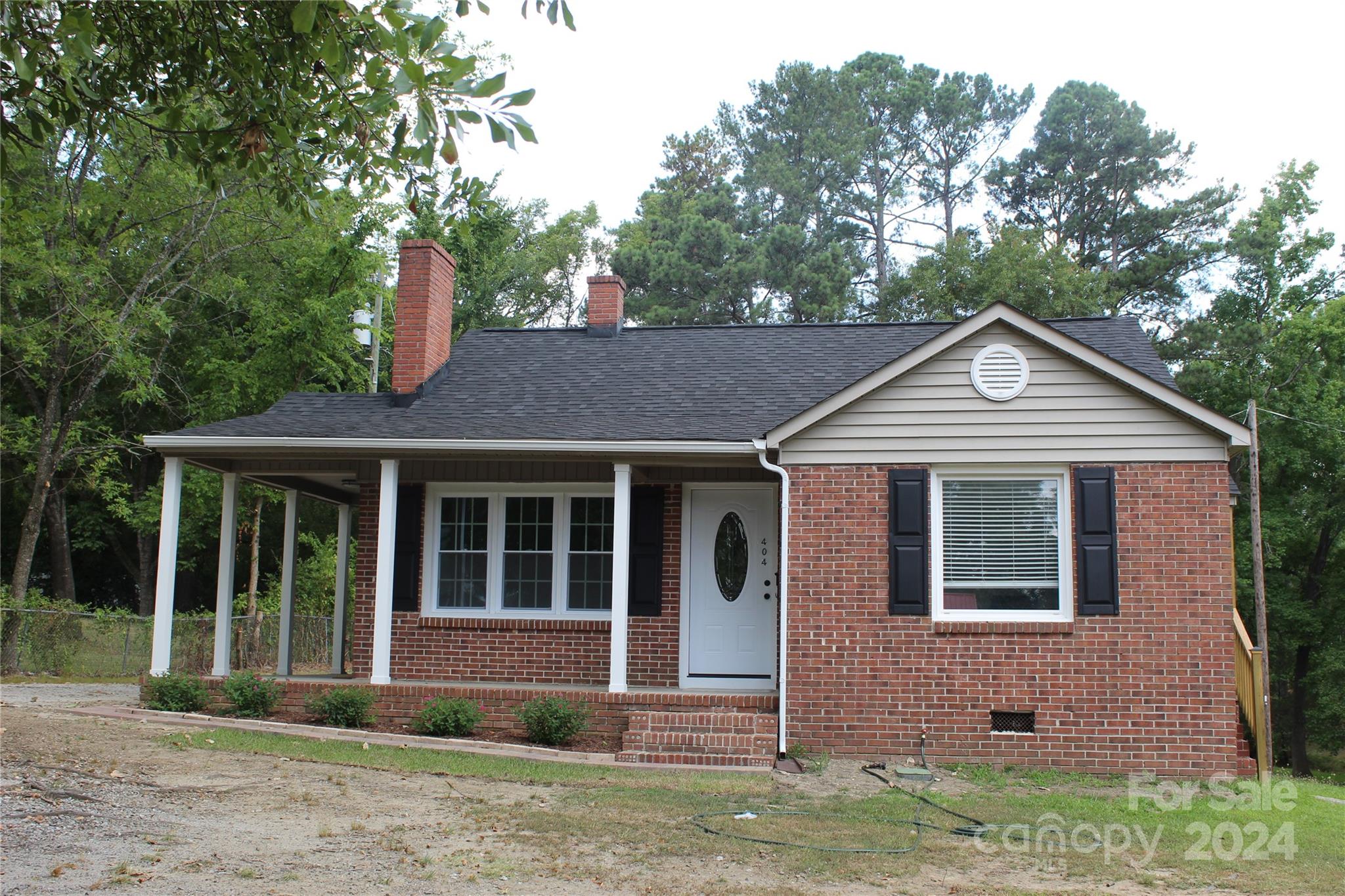 This 3br/2ba updated home is like new and is situated near the hospital, medical offices, shopping, restaurants and the Lindsey Pettus Greenway trail. Easy assess to Hwy 521. Home is freshly painted. The galley Kitchen has new cabinets, granite counter tops and fixtures. Includes new range, refrigerator, dishwasher, microwave and disposal. Has a separate dining room. New roof & gutters 2024. New windows except for dining window which did not need replacing. Three new exterior doors. New LVP flooring in LR, DR, kitchen, hall and baths.  New carpet in bedrooms. New exterior shutters . Breaker box upgraded to 200 amp. New porch columns, New side porch railings. Termite warranty transferable to new owner. The heating system was replaced in 2022 and entire duct work replaced in 2024. A short walk to the Lancaster High school or Lindsay Pettus Greenway.