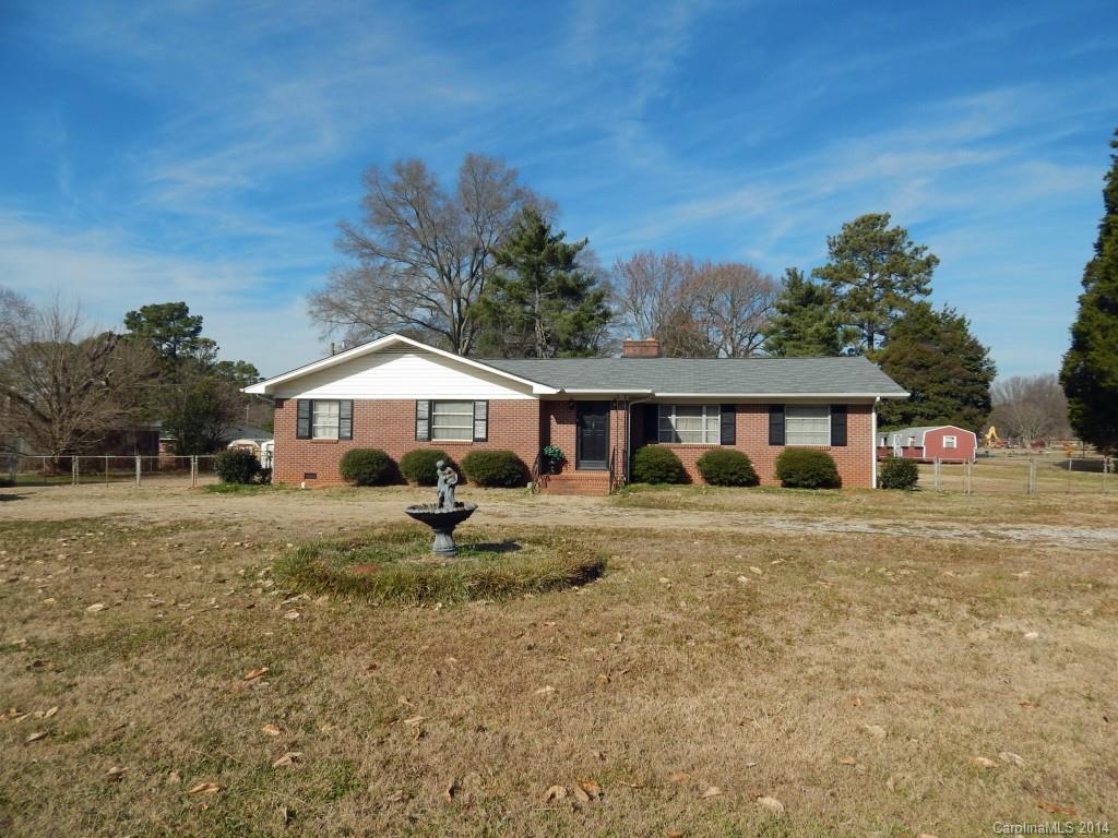 Wonderful home with lots of character on a large lot! This house features a lot of space, large bedrooms, and a large kitchen with attached formal dining room! Behind the house you will find a fenced-in yard, a car port, and a storage shed that remains. Also attached is a windowed/screened-in porch.