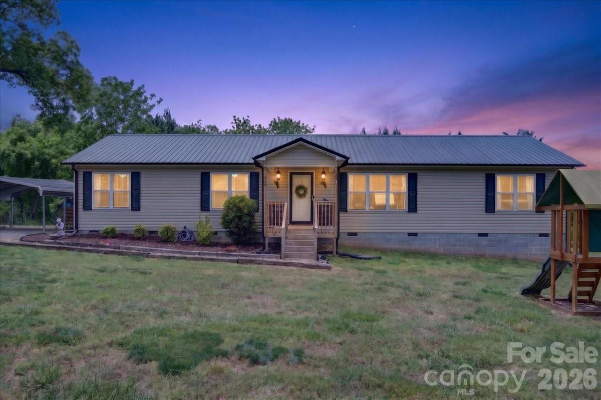 Welcome to this charming 3-bedroom, 2-bath home located in the peaceful countryside of Mocksville. This well-maintained property offers a comfortable and functional layout with inviting living spaces perfect for everyday living and entertaining. The kitchen provides ample cabinet space and flows easily into the dining and living areas, creating a warm and open feel. The spacious primary suite features a private bath, while the additional bedrooms offer flexibility for family, guests, or a home office. Enjoy the quiet surroundings and outdoor space ideal for relaxing, gardening, or gatherings. Conveniently located with easy access to nearby highways, shopping, and dining, this home offers the perfect blend of privacy and convenience. A great opportunity to own a move-in ready home in a desirable location!