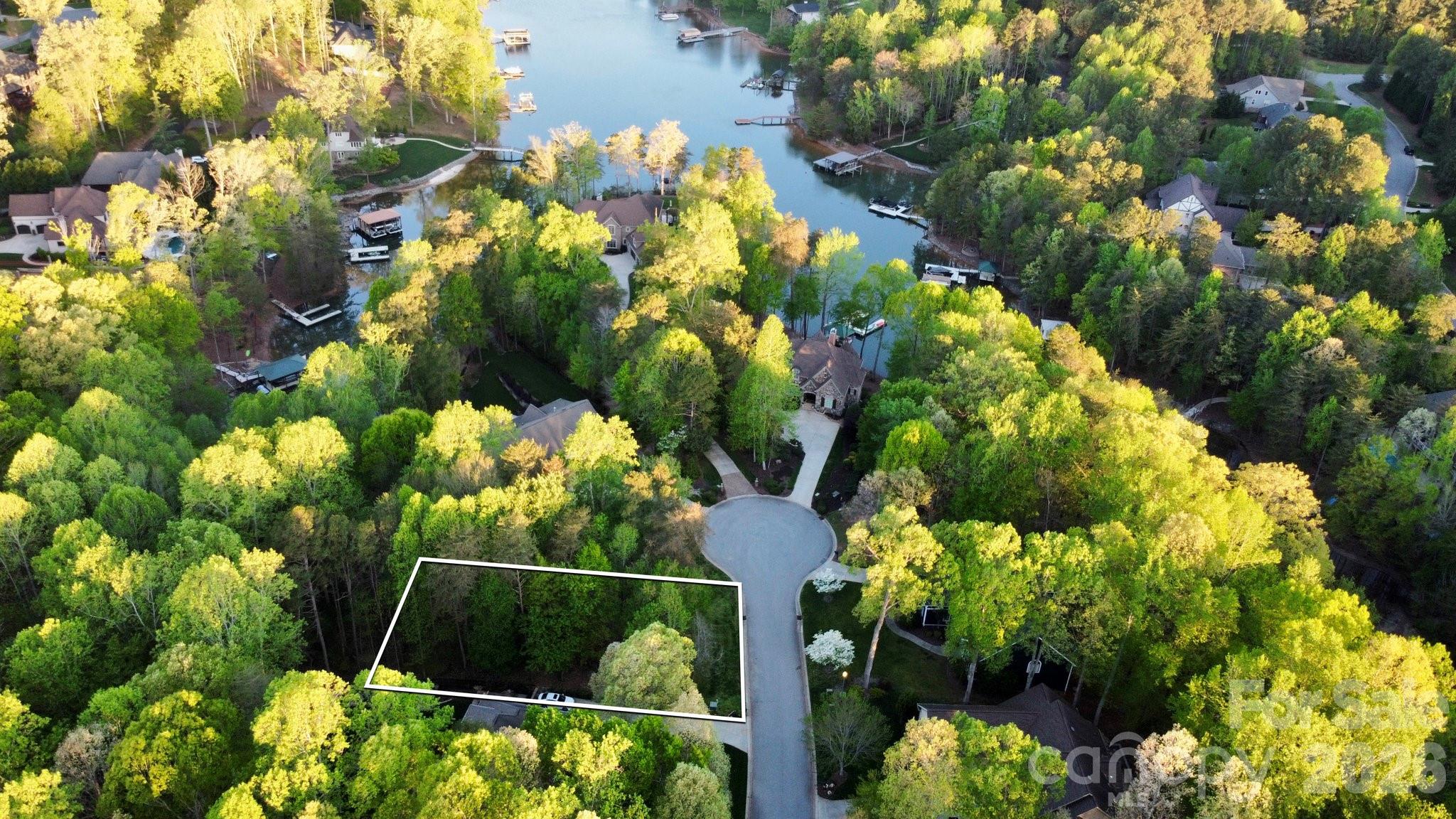 This stunning waterfront, wooded, sloped lot in the quiet Lakewood community offers the perfect setting for your dream home. Located on a cul-de-sac and at the end of a peaceful cove, this property boasts water views and privacy. Just minutes from the Little Creek Boat Access Area, it’s ideal for water enthusiasts. The lot is in an established community with county water and sewer, plus natural gas is available. HOA boat storage is offered for an additional fee. Conveniently located with an easy commute to Charlotte and close to restaurants, shopping, medical facilities, and schools, this lot offers the perfect balance of peaceful lake living and accessibility to local amenities. Don’t miss this opportunity to create your perfect lakeside retreat!