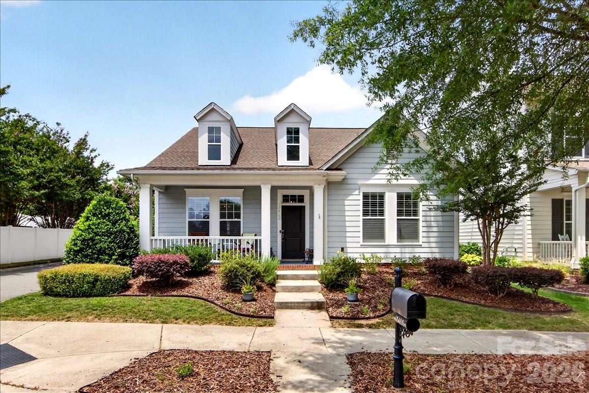 Tucked into the sought-after Bailey Springs community of Davidson, this charming 1.5-story home offers the perfect blend of character, quality updates, & low-maintenance living. A covered rocking chair front porch & long entry foyer with arched doorways welcome you inside, where you'll find newer prefinished natural-looking hardwood flooring, a beautiful marble tile fireplace surround, & a remodeled kitchen (2024) featuring new cabinetry, quartz countertops, & large gray subway tile backsplash. The main level offers incredible flexibility with a spacious primary suite, guest bedroom/bath, formal dining room, breakfast area, & a private office/study with French doors—all thoughtfully laid out for everyday living. Upstairs, a massive loft & additional guest suite create the perfect secondary living space. The primary bath impresses with a tiled glass shower, dual vanity, tile flooring, & a custom built-in closet system. Step outside to your peaceful backyard courtyard; a gardener's paradise shaded by mature plantings, a Japanese maple, & lush greenery, all surrounding a covered patio with virtually no grass to maintain. A detached 2-car garage completes the package. Community access to Davidson's extensive Greenway system puts miles of trails & charming downtown Davidson just steps away. All of this with convenient proximity to downtown Davidson (3.2 mi) & Cornelius (2.8 mi), Birkdale Village (5.3 mi), I-77 (5 mi), various golf clubs, shopping, and dining. This is Davidson living at its finest! Note: All HVAC/Furnaces & Water Heater updated in last 6 years.