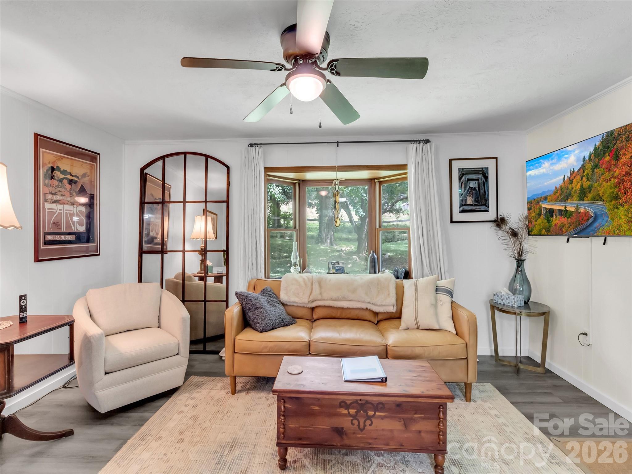 Discover the perfect blend of serenity and connectivity in this charming 2-bedroom, 2-bath mountain cottage. Whether you’re working remotely and looking for a peaceful retreat or simply seeking a base camp for your weekend adventures, this home delivers.

Unwind on the expansive, covered front porch—the ultimate space for morning coffee or evening unwinding. The property features a fully fenced yard and a rustic barn, offering incredible potential for a home office studio, workshop, or hobby space.

Situated just minutes from the vibrant dining and shops of downtown Waynesville and the scenic trails of Lake Junaluska, you’re never far from the action while retaining the privacy of mountain living. Grocery shopping on Russ Ave is just a quick trip away, making errands effortless. This is an incredible opportunity to own a piece of Western North Carolina that adapts to your lifestyle.
