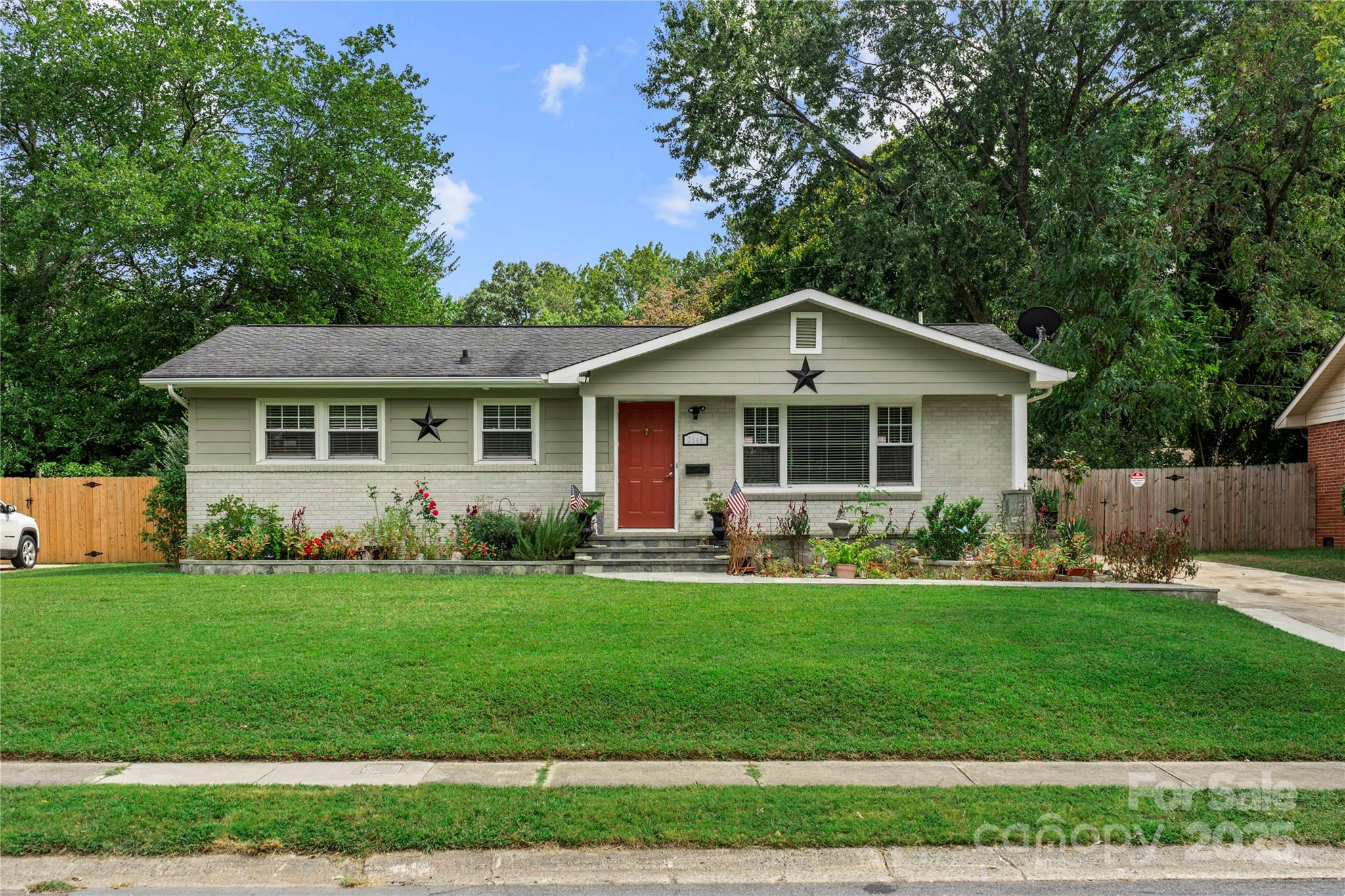 This home is the perfect blend of city convenience and peaceful outdoor living—without the restrictions of an HOA! The charming whitewashed brick exterior gives the home a modern touch while maintaining its classic appeal.
Inside, original hardwood floors add warmth and character to this 3-bedroom, 1.5-bath home. The kitchen boasts ample cabinet space and stainless steel appliances, making it both stylish and functional. Home boasts natural light, creating a bright and inviting atmosphere.
Outside, the possibilities are endless! A ready-to-use garden bed awaits your green thumb you have the freedom to create your own outdoor oasis. Plus, additional storage is available in the included sheds.
Located just 10 minutes from Uptown Charlotte and the airport, this home offers easy access to everything the city has to offer while providing a serene retreat at the end of the day.
Don’t miss your chance to see this unique home in person!