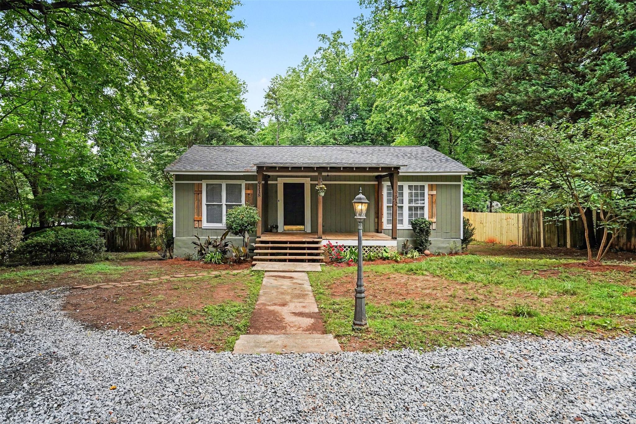 Welcome to this beautifully updated 3-bedroom, 2-bathroom single-family ranch tucked away on a quiet private road in Charlotte, North Carolina. Situated on a fully fenced lot spanning nearly half an acre, this move-in ready home offers the rare combination of privacy, modern updates, and unbeatable convenience — all with no HOA restrictions.

Major system updates provide peace of mind, including a brand-new roof (2026), heat pump (2026), and well pump (2026), along with a water heater replaced in 2021. Enjoy relaxing mornings on the covered front porch or unwind on the back deck overlooking the expansive fenced backyard surrounded by mature trees and natural beauty near Thayer Road Park.

Conveniently located just 2 minutes from I-85, approximately 7 minutes from Charlotte Douglas International Airport, and only 15 minutes from Uptown Charlotte, this home offers quick access to shopping, dining, entertainment, and commuting routes while still maintaining a peaceful setting. Outdoor enthusiasts will also love being moments away from Kevin Loftin Riverfront Park and its nearby boat launch, perfect for kayaking, fishing, and enjoying the Catawba River.

Inside, you’ll find a bright and inviting layout filled with natural light from the home’s large windows. The renovated kitchen features brand-new cabinetry, creating a clean and modern space ideal for cooking, entertaining, and everyday living. The spacious main-level primary suite includes a private en suite bathroom complete with a beautifully tiled walk-in shower for a spa-like retreat.

If you’ve been searching for a renovated ranch home in Charlotte with land, no HOA, and easy access to Uptown and the airport, 9118 S Lakebrook Rd is a must-see opportunity.