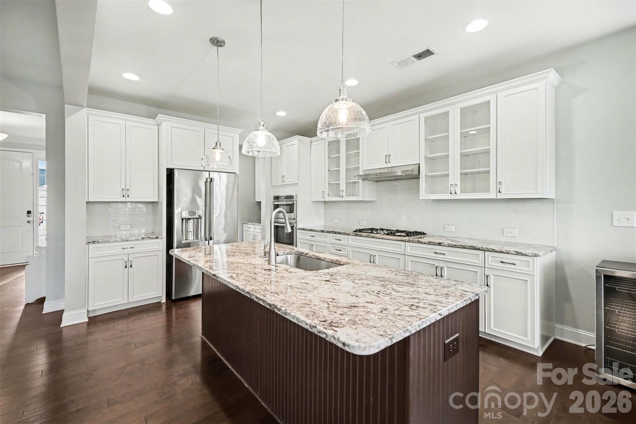 Price improved to reflect current market conditions: this home presents one of the best values in Bent Creek. 

Welcome to 7200 Irongate Drive, a spacious and thoughtfully designed home located in the desirable Bent Creek community, right on the border of Waxhaw with the benefit of South Carolina taxes.

This elegant six-bedroom, five-bath home offers a refined yet comfortable living experience, beginning with an inviting main level featuring hardwood floors, gracious living spaces, and a private guest suite.

The chef-inspired kitchen anchors the home with upscale finishes, abundant cabinetry, and an oversized island seamlessly connecting to the main living areas for effortless entertaining. Upstairs, the primary suite provides a peaceful retreat with a spacious bedroom and bath, complemented by additional bedrooms and a versatile loft.

The fully finished walk-out basement offers remarkable flexibility, complete with a secondary living area, bedroom, and full bath - perfect for hosting, relaxing, or creating a private haven. Outdoors, the home backs to mature woods, offering privacy and a serene backdrop enjoyed from the covered deck and patio.

Enjoy the convenience of being just minutes from Waxhaw’s shopping, dining, and charm, while benefiting from Lancaster County’s value.