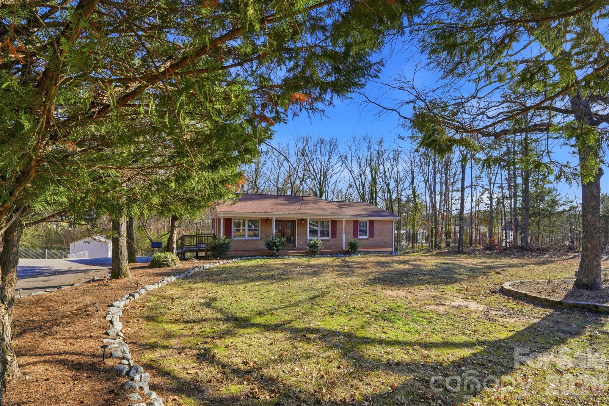 Qualifies for 100% financing & $10,000 in closing costs!!! This 3-bedroom, 1-bath brick ranch delivers the kind of flexibility and lifestyle today’s buyers are searching for. Move-in ready yet full of potential, the home features a partially finished basement currently used as a den or optional fourth bedroom, plus a large unfinished basement area with exterior access and a garage door—ideal for storage, a workshop, or future finished space. Step outside to a half-acre lot designed for relaxing and entertaining, complete with a backyard tiki bar and storage shed, offering room to host, garden, or expand your outdoor vision. Whether you’re a homeowner looking to personalize over time or an investor seeking upside, this property checks both boxes. Surrounded by ongoing development and new construction, the location offers the best of convenience and recreation—minutes to the Whitewater Center, downtown Mount Holly, Belmont, Pine Island Country Club, Mountain Island Lake, parks, dining, shopping, and Charlotte Douglas International Airport. A rare opportunity to enjoy space, versatility, and long-term growth in a rapidly evolving area.