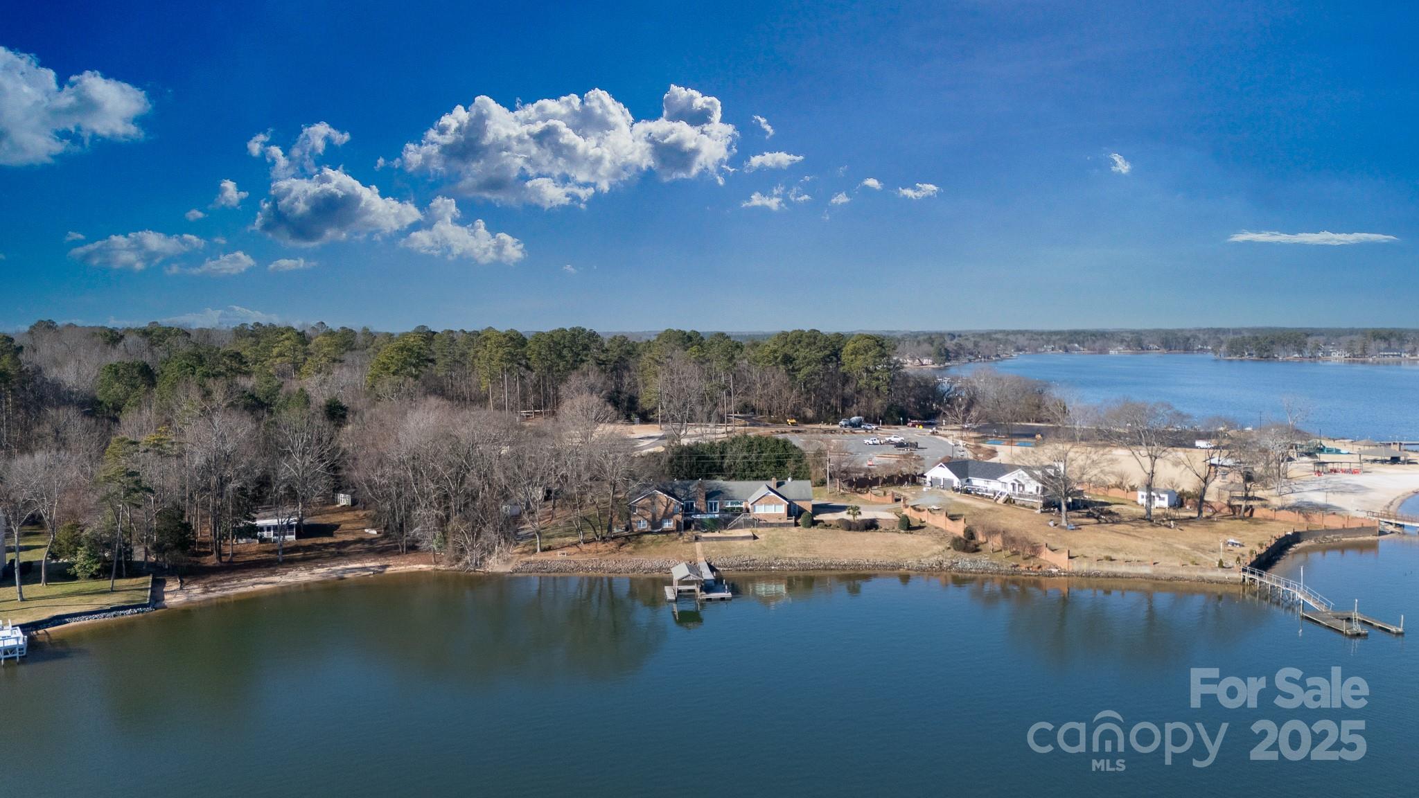Vacation at home! Enjoy watching amazing sun rises while relaxing on the deck having coffee. Check out the moon and the stars from the swim spa in the evening, useable year-round. Lots of room for entertaining or if you don't enjoy entertaining at home, take your boat up the Lake to a restaurant on the water! Enjoy the convenience of your very own boat launch and floating dock just out front. Storage rack for kayaks conveniently located right at the launch. Outdoor shower for rinsing off sandy feet. Walkout basement apartment or In-Law suite.  
36' x 18' Metal workshop on slab w/ power- water source just outside rear door- Roll-up door-front and solid entry door-rear
12 Hour Notice for showing.