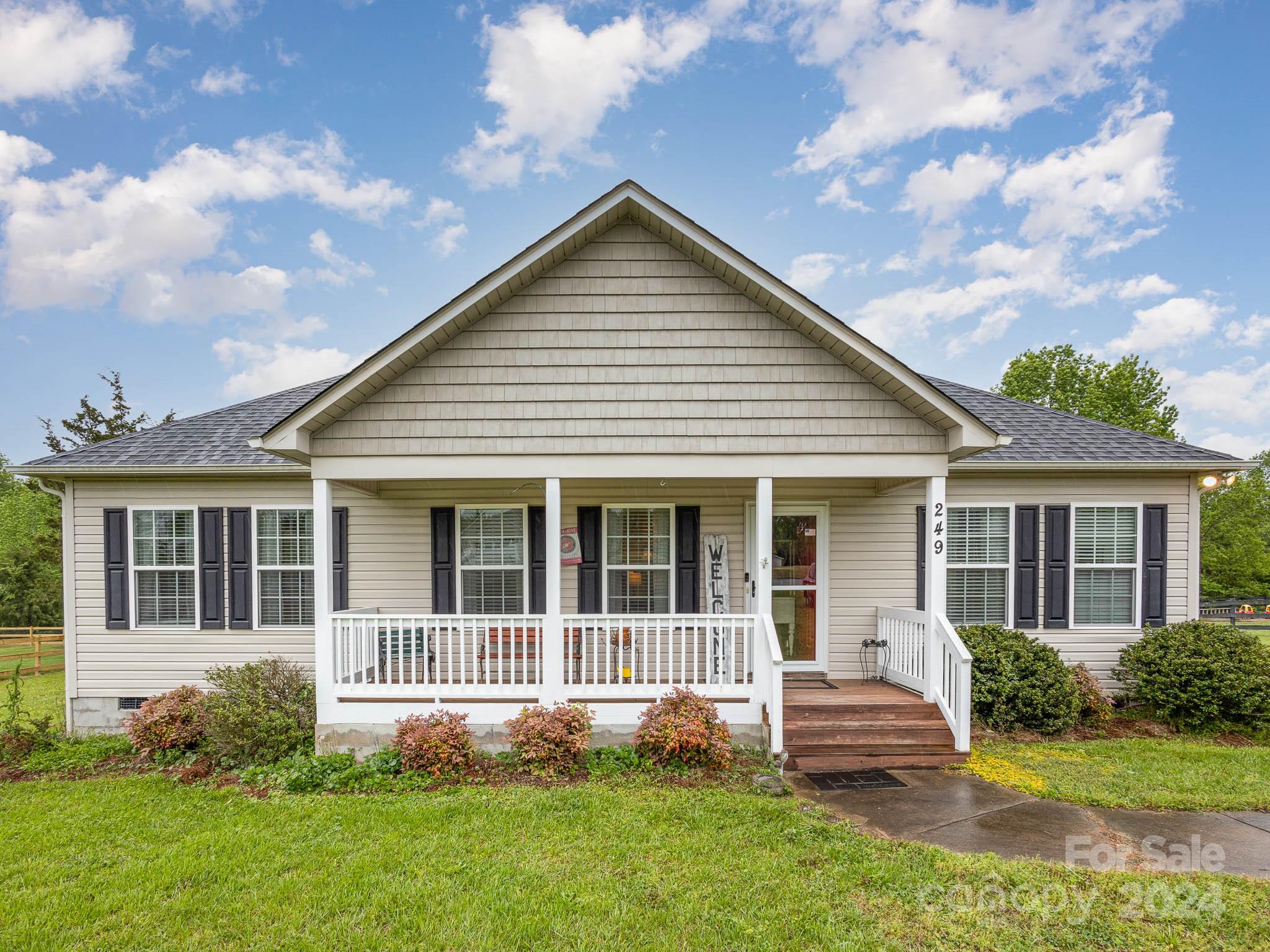Come on home to 249 Springlake!  Enjoy the split floor plan, with large backyard & screened in porch.  3 Bed 2 bath.  You will love the flow of the home with vaulted main living area that flows to breakfast nook and right on out to the covered screened-in porch, where you are able to view a natural landscape.   Kitchen updated with lovely cabinets, granite and new appliances (approx 2018), primary bath has new step-in-shower and wood look tile. Tray ceilings in primary bedroom. Secondary bath has tile floors.  Big yard with a shed. And don't forget the front porch!!