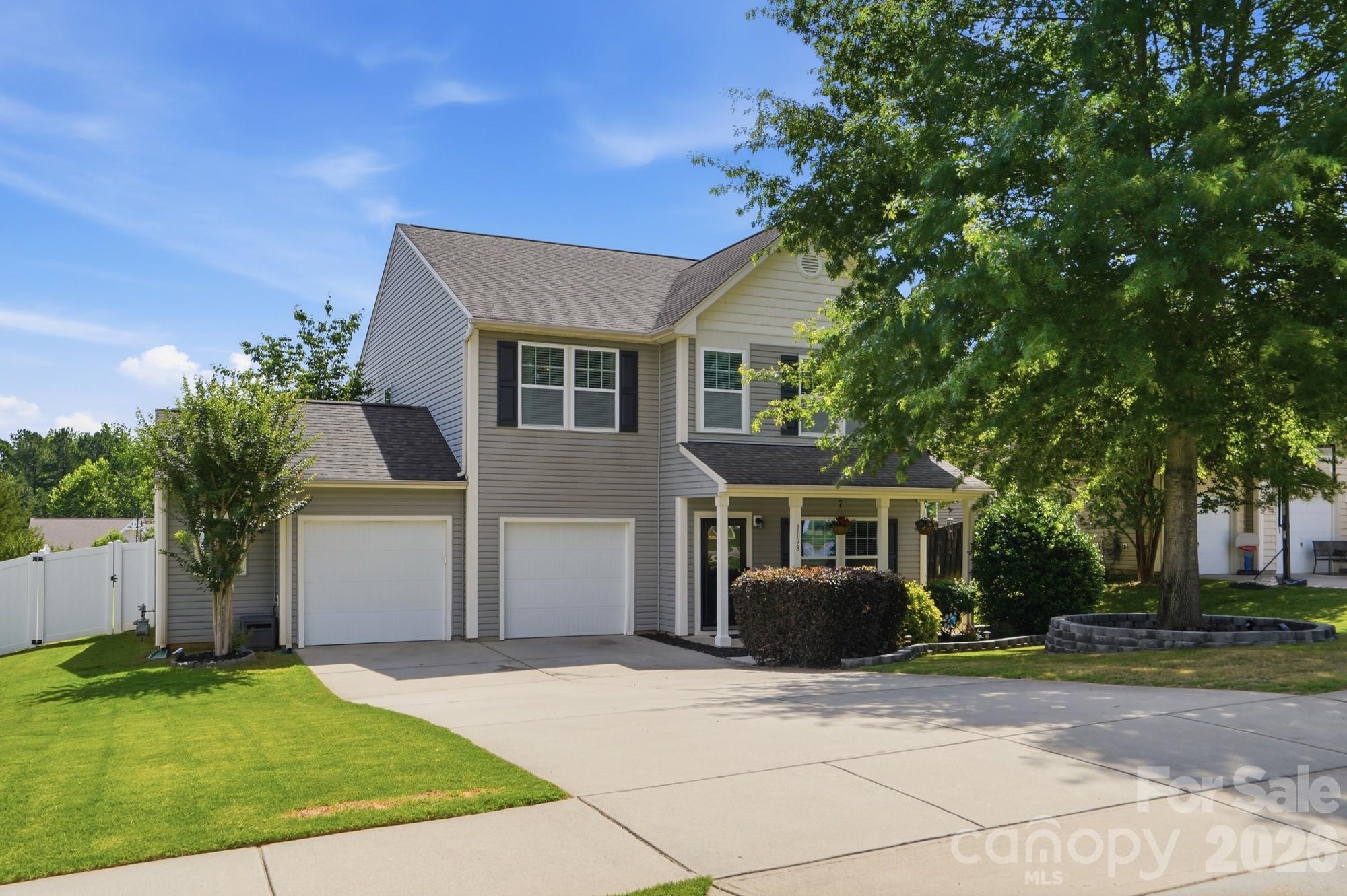 Welcome to 1198 Jasmine Drive! Start your mornings on the covered front porch with a cup of coffee, and end your days in a home that just feels easy to live in. Step inside to discover beautiful wood flooring throughout the main level, staircase, and upstairs hallway. The open concept floor plan provides a comfortable flow for both daily living and entertaining. Just off the foyer, the office/flex room offers a great space for working from home, a playroom, or a sitting area. The dining room features chair rail molding and connects to the kitchen through a convenient butler's pantry. The chef-inspired kitchen boasts granite countertops, stainless steel appliances, a gas stove, a walk-in pantry, and a stunning three pane window overlooking the backyard, filling the space with natural light. The large living room flows seamlessly with the kitchen, creating an ideal space for both relaxing and entertaining. A convenient drop zone helps keep daily essentials organized, while the charming powder room with beadboard detailing adds character and style. Upstairs, the primary suite feels like a comfortable retreat. The bedroom features a tray ceiling, ceiling fan, and a spacious layout that makes it easy to relax and recharge. The attached bath includes dual sinks, granite countertops, a garden tub, and a tiled shower, along with a walk-in closet for everyday storage. Three additional bedrooms, each with ceiling fans, provide flexibility for family, guests, or hobbies. A large laundry room with a storage closet is also conveniently located on the second floor, making everyday chores a little easier. Outdoor living is just as impressive with a screened-in porch overlooking the fully fenced, flat backyard. Enjoy evenings around the fire pit, host gatherings on the beautiful paver patio, or simply relax and take in the private outdoor space. Ideally located close to shopping, dining, and everyday conveniences, with easy access to the highly sought after Ballantyne area, this home offers the perfect combination of location, comfort, and lifestyle.