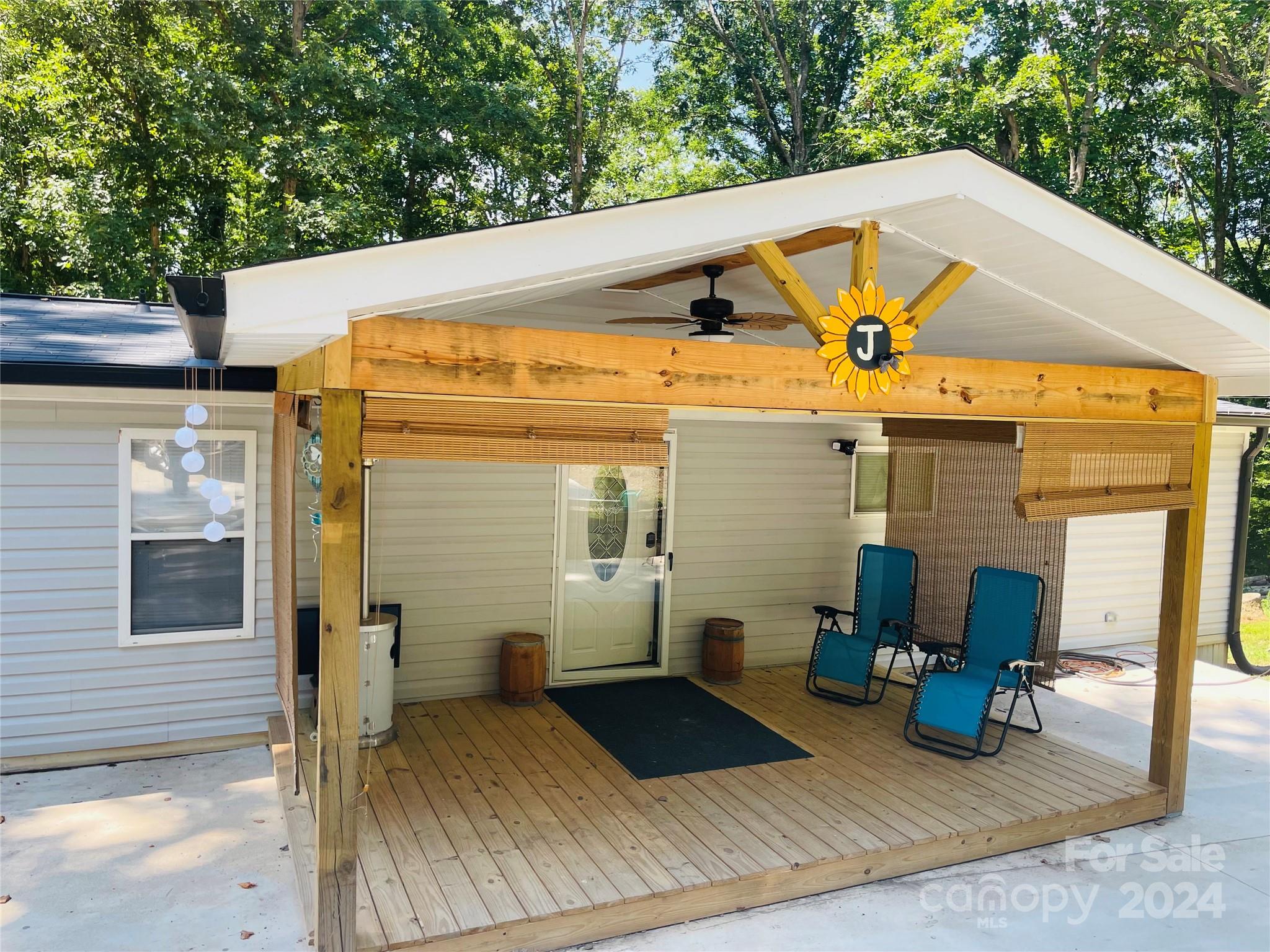 This adorable home nestled in the woods is the perfect retreat you've been looking for!  Almost everything has been updated, inside and out from the siding to the deck, appliances, flooring, countertops and much more.  The 3rd bedroom was converted into a full laundry room, but the washer and dryer can be moved back to the kitchen where they were originally stored, in order to retain that as a bedroom if wanted.  Its the perfect country oasis with all of the privacy.   The private drive has a gorgeous view of the neighborhood pond.  Don't miss your opportunity to settle back into nature! 

**RV pad has electric, well and septic ran to it.