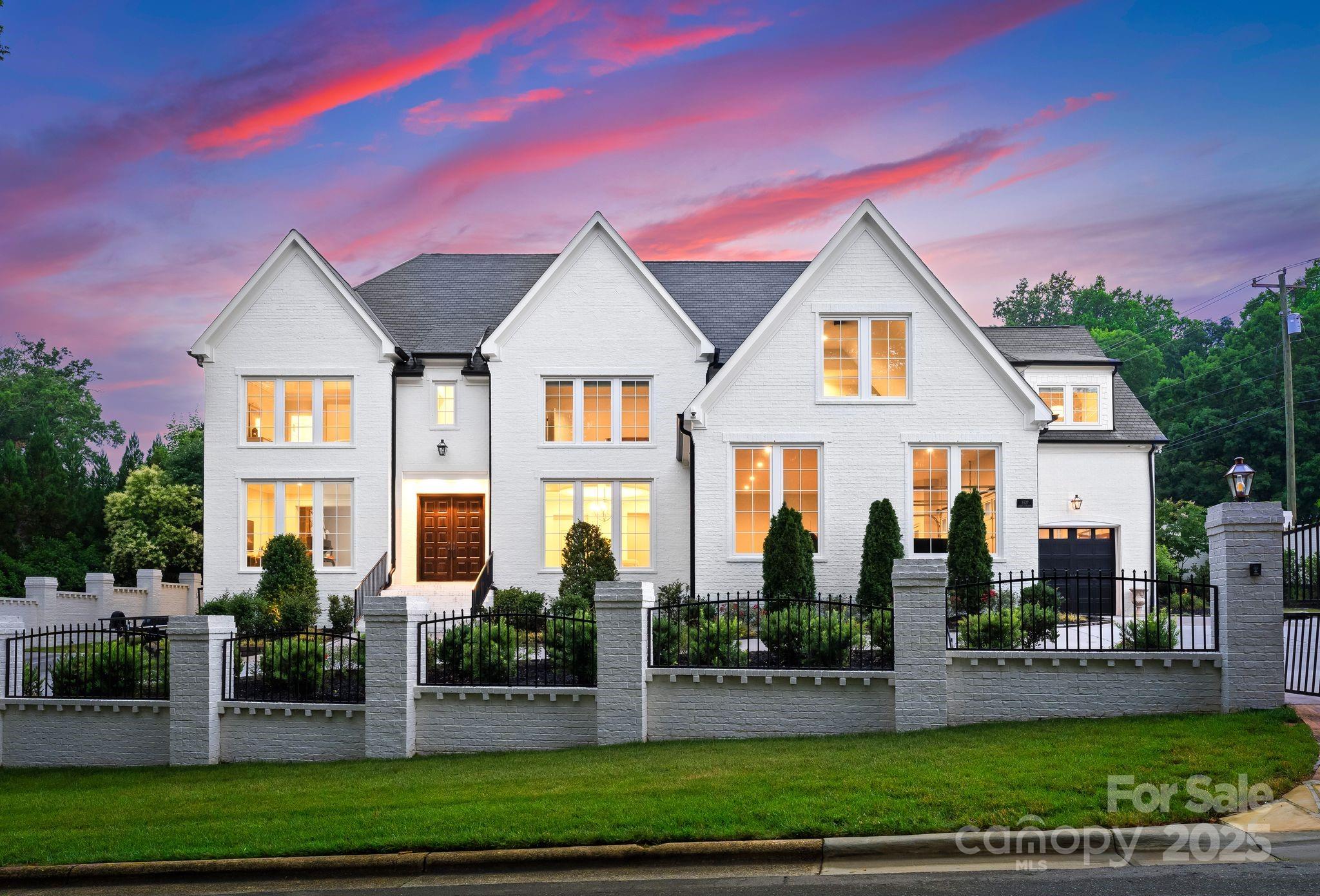 This custom home is the epitome of luxury, offering 9600 plus  sq ft, full brick home and located in the prestigious Carmel Park neighborhood of SouthPark. Enclosed by a 12-ft brick fence for privacy & security, this estate blends modern elegance with traditional charm. The interior offers a open floor plan with wood floors & spacious living areas. The stylish chef's kitchen, boasts marble countertops, custom cabinets & a striking backsplash outfitted with premium appliances & an oversized island for gatherings. The wine cellar & scullery enhance the entertainment options. The living room, with vaulted ceilings, exposed beams & stone fireplace, offers a blend of sophistication & comfort. The primary suite on the main level features a spa like bathroom with dual rain head showers, floating tub & expansive WIC. The expansive backyard, with a pool is perfect for entertaining. Upstairs introduces additional bedrooms, private bathrooms, theater room and game room. Amazing opportunity!