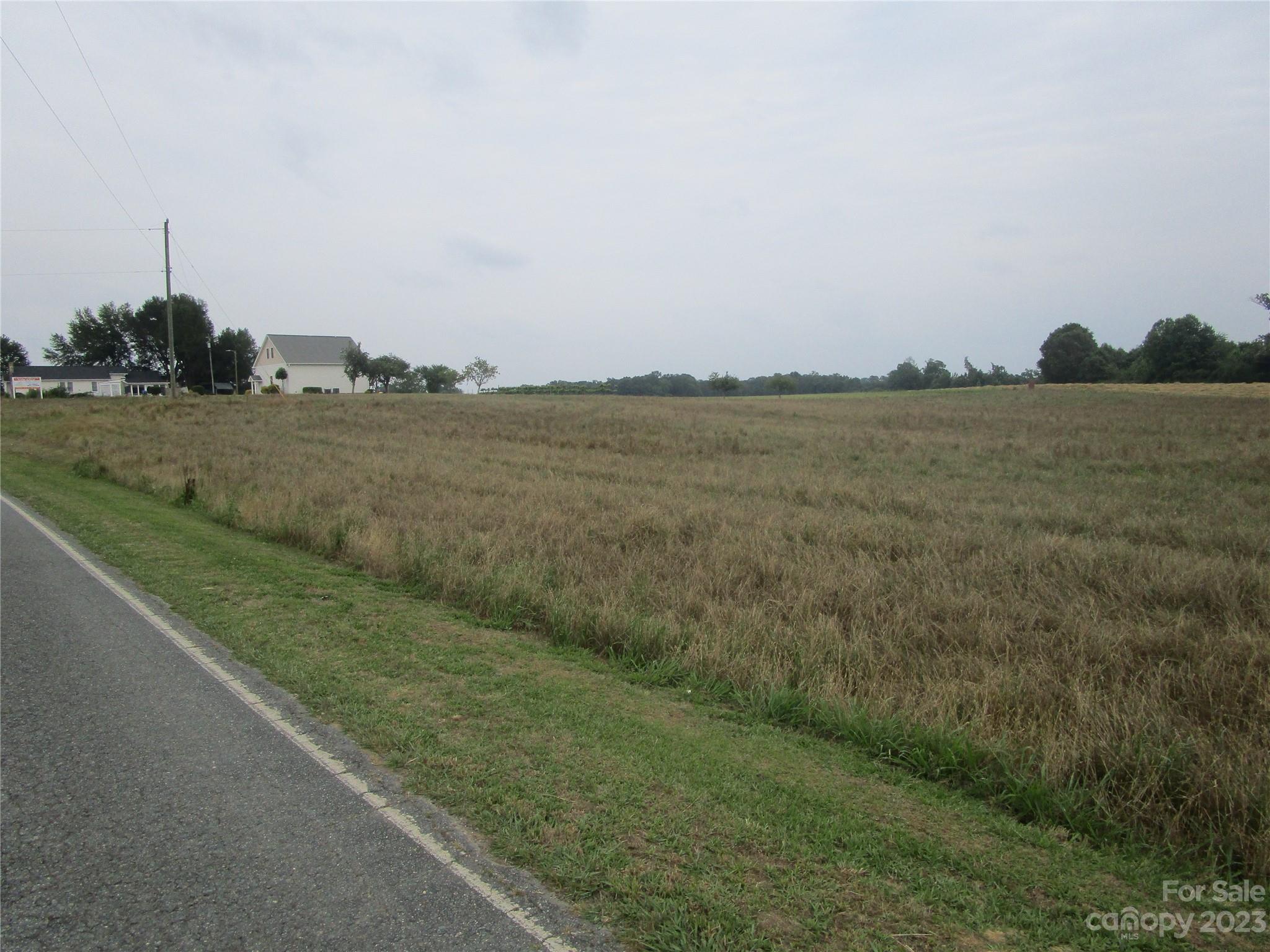 Beautiful, level acreage (Tract I) in picturesque country setting. Conventional perc site and county water close but would be Buyer's/Builder's responsibility to access county water. Amazing homesite with 5 acres perfect for your gorgeous custom home! Popular, rapidly growing area features rural setting close to University, shopping, schools, hospital, golf course,etc. Easy access to Highway 74 and by-pass.  Come and pick out your Tract today! Take the time to come and check this out. You will be impressed! Last vacant tract left!! Don't miss out!!