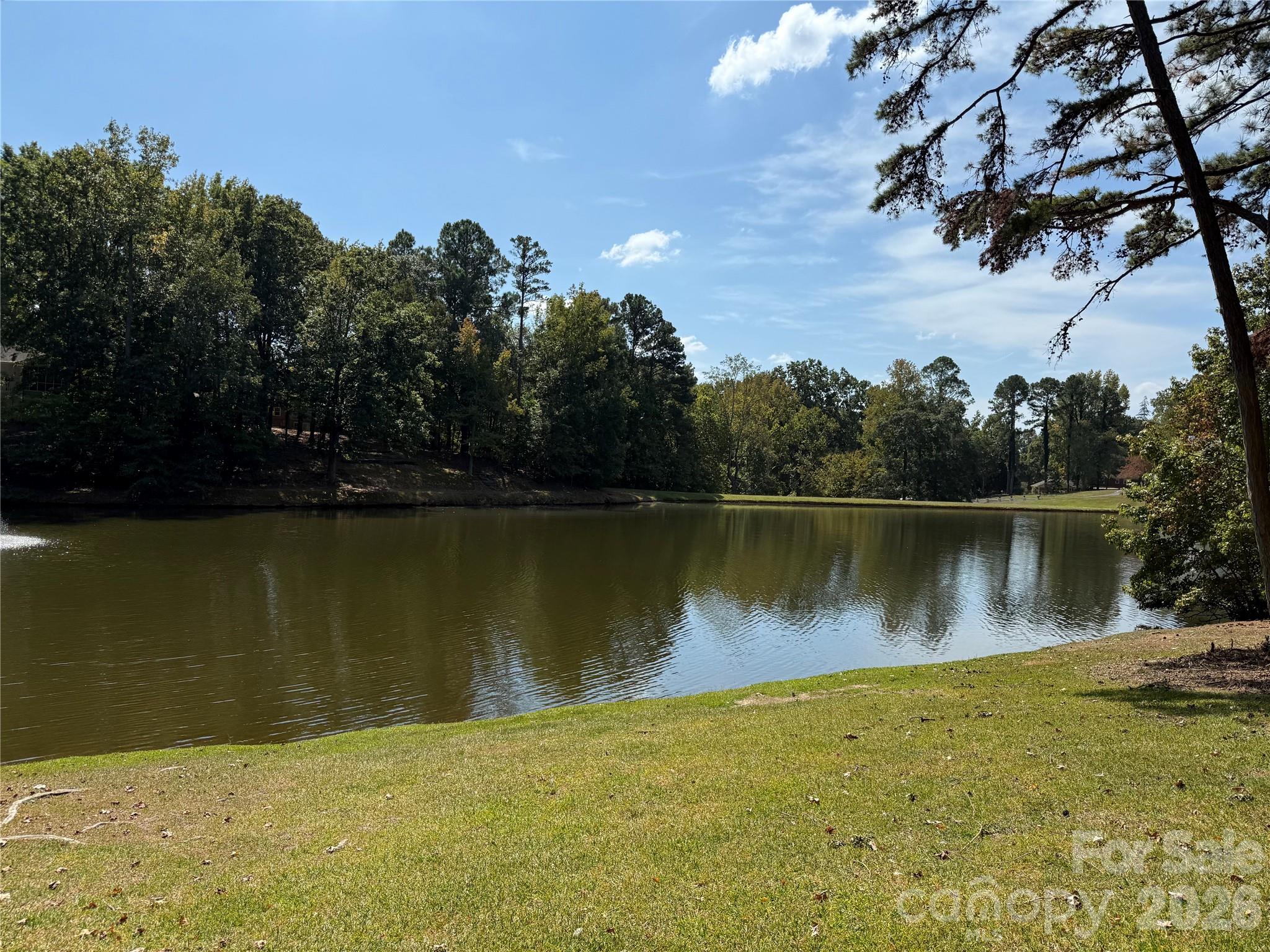 MAJOR PRICE REDUCTION! 
 Large home and lot to enjoy the beauty of the lake.  This home has enough room for everyone.  Great for entertaining and very spacious.
Formal living room with fireplace, formal dining room with wooden floors, and den with a fireplace, built in cabinet /wet bar. Flex room that could be made into an office or a quiet space with great views of the lake. Sunporch that opens up to the living room and den.  Kitchen and breakfast room have a direct view to the lake. Kitchen includes an Island, breakfast bar and desk. Great number of cabinets that has been resurfaced recently. Electric cooktop, double ovens and refrigerator. Upstairs has 4 bedrooms, 3 baths. The primary bedroom is a large suite, with walk-in closets. The bath has a shower and a separate tub.  Basement area has a study with a fireplace, gym with equipment, game area and a wine cooler with cedar racks and a cooler that keeps the room at the right temp for storing wine. There are an additional storage and workshop with interior and exterior entrances.
Main level has a 2nd living area with a bedroom, living room, full bath and walk-in closet. You can get access with an interior door or an exterior entrance. Perfect for in-law suite.