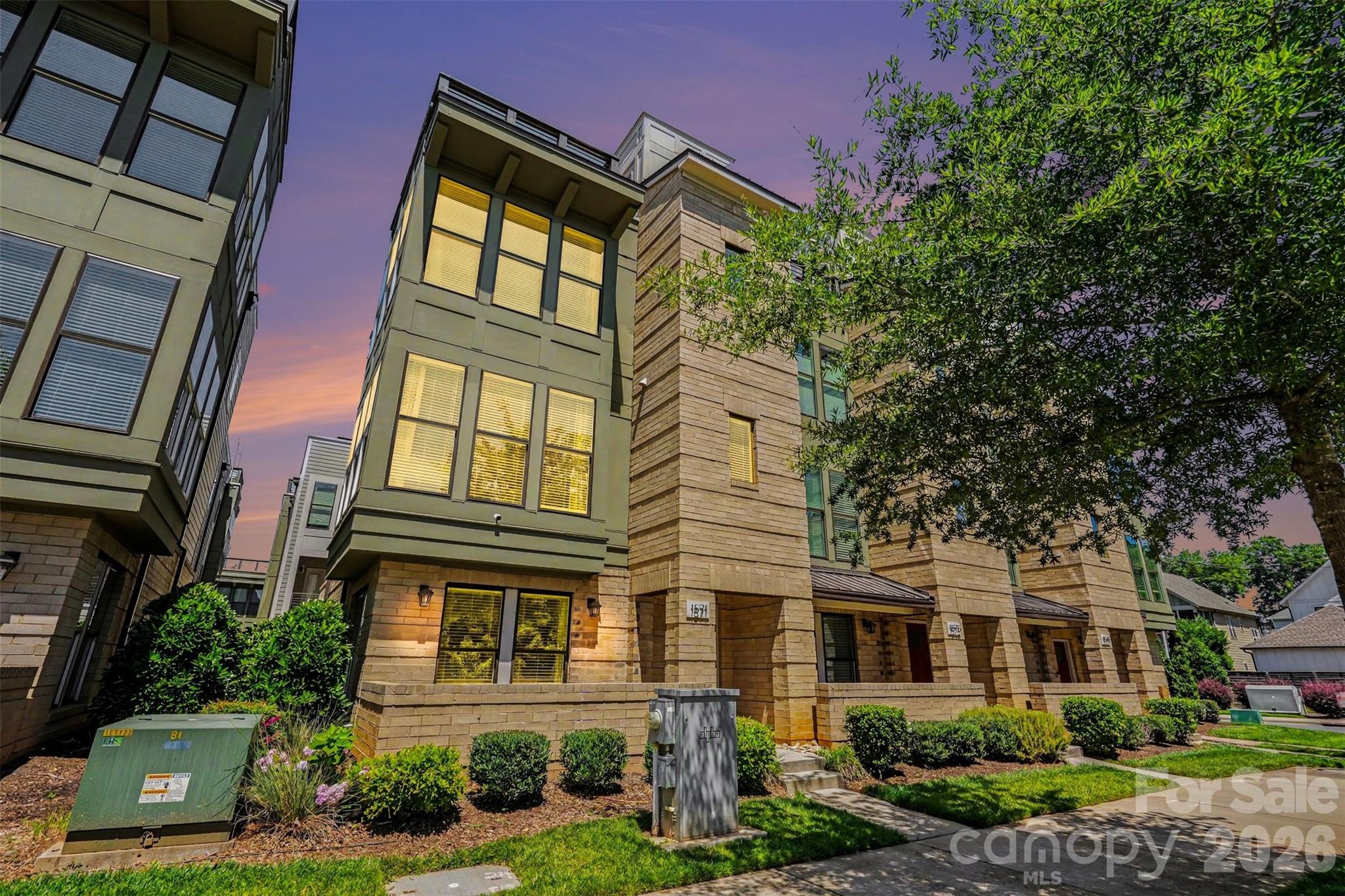 Welcome to premier urban living at Uptown West Terraces in the highly sought-after Seversville neighborhood! Built in 2020, this pristine, end-unit modern townhouse offers a perfect blend of sleek contemporary style, luxury finishes, and an unbeatable location. Spanning four thoughtfully designed levels, this site-built home delivers 2,122 square feet of primary heated living area with spaces tailored for both relaxation and high-end entertaining.

Sophisticated Interiors: Step onto beautiful 7-inch pre finished hardwood floors that run throughout the home, complemented by elegant oak stairs.
Chef’s Kitchen: The open-concept kitchen is a culinary dream, complete with quartz countertops, a custom tile backsplash, a spacious kitchen island, a walk-in pantry, and stainless-steel appliances. Enjoy clever storage upgrades like roll-out trays and built-in trash pull-outs.
Ultimate Rooftop Terrace: Host unforgettable gatherings or unwind after a long day on your private rooftop terrace, boasting truly spectacular views of the Uptown Charlotte skyline.
Flexible Living Space: Featuring 3 spacious bedrooms and 3.1 beautifully tiled bathrooms. The lower level includes a private bedroom and full bath, ideal for a home office, gym, or guest suite.
Parking & Storage: Includes an attached 2-car garage with a concrete driveway and automatic opener, plus convenient on-street parking options.
Pet-Friendly Perks: The vibrant community is entirely completed (no construction noise!) and features an on-site dog park, community park with sitting benches, and manicured sidewalks.
Low Maintenance: The monthly HOA fee covers lawn maintenance and an in-ground irrigation system, letting you enjoy lock-and-leave convenience.
Location, Location, Location! Live minutes from the best Charlotte has to offer! You are a short stroll or ride from Rhino Market, Town Brewing Co., local greenways, and the City Gold Line Streetcar for seamless commutes into the heart of Uptown.

Don't miss your chance to own an exceptional end-unit in one of Charlotte's hottest areas!