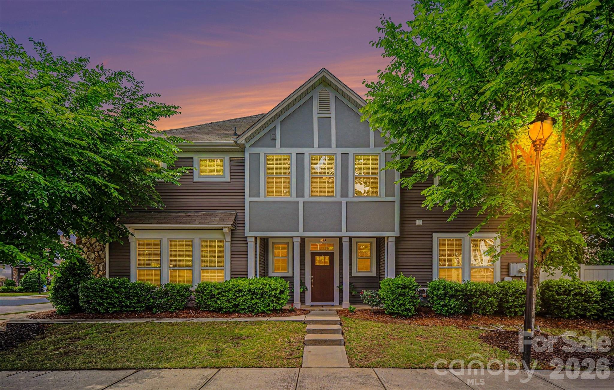 PRICE IMPROVEMENT - BEST TOWNHOME VALUE IN THE ZIP CODE! 
Beautiful end-unit townhome in a highly desirable Fort Mill location—just minutes to I-77, Charlotte, grocery stores, dining, and everyday services, this property offers the ideal blend of convenience, functionality, and low-maintenance living.
The main level features an open-concept layout with abundant natural light. The kitchen is appointed with white cabinetry, granite countertops, and a large center island, seamlessly connecting to the dining area and spacious living room with fireplace—perfect for both daily living and entertaining.
Upstairs, you’ll find three bedrooms plus a versatile loft, ideal for a home office, media space, or flex area. The primary suite includes a generous walk-in closet, while the two secondary bedrooms share a full hall bathroom.
Additional highlights include an oversized 2-car garage and the privacy of an end-unit location.
The community offers desirable amenities including an outdoor pool with cabana, playground, green space, and sidewalks.
Amazing value blending a great floor plan, convenience, access and low-maintenance in a prime Fort Mill setting.