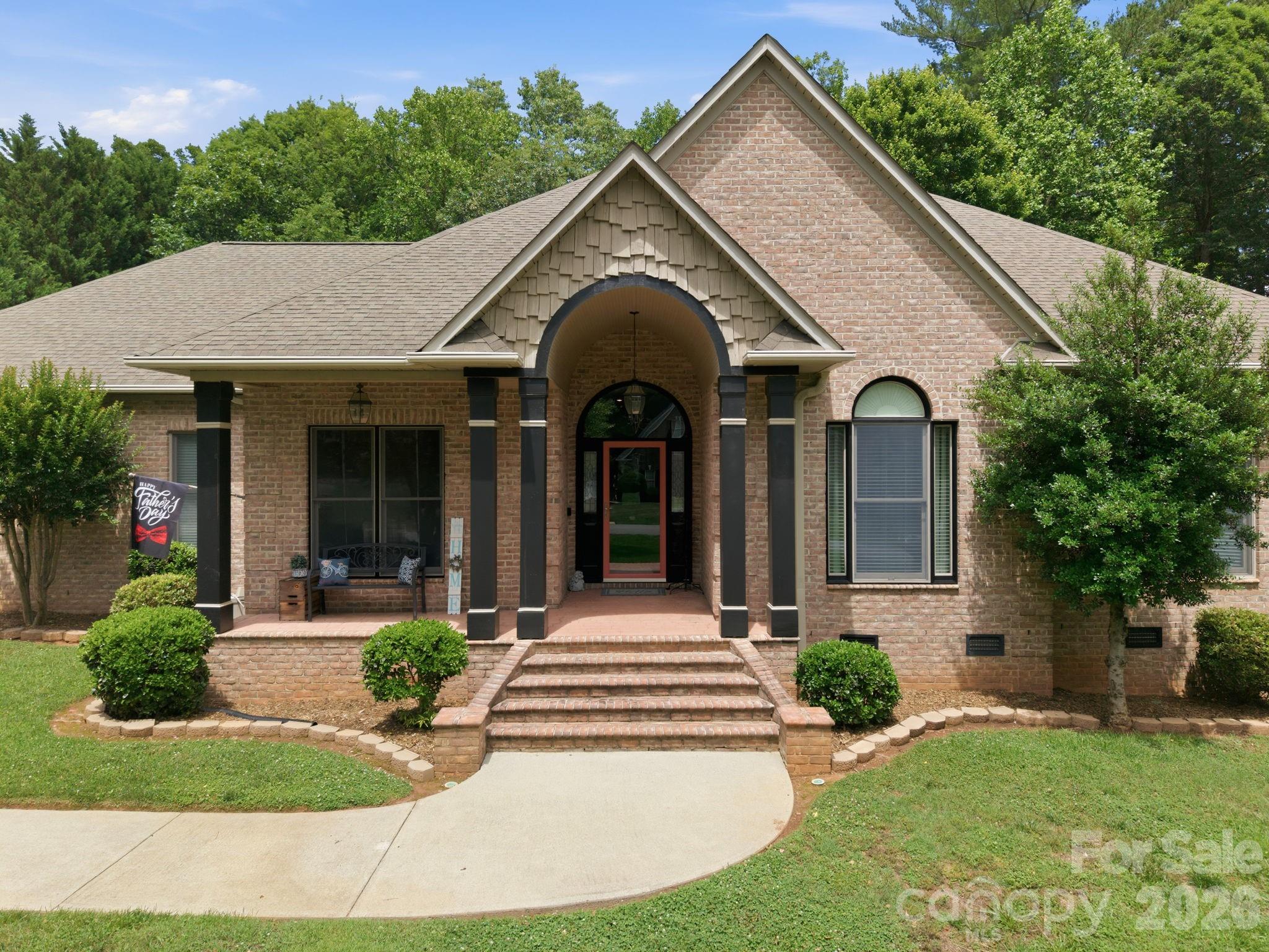 Welcome home to this beautifully maintained one-level residence nestled on a generous 0.67-acre lot in one of Hickory’s established neighborhoods. Offering over 2,700 square feet of heated living space, this home combines comfort, functionality, and thoughtful updates throughout.

The spacious main level features 2,345 heated square feet with an inviting floor plan designed for everyday living and entertaining. The primary suite serves as a private retreat with a walk-in closet, soaking tub, separate shower, and heated tile flooring in the ensuite bath. Secondary bedrooms are generously sized, providing flexibility for family, guests, or hobbies.

The well-appointed kitchen features granite countertops, custom cabinetry, a gas range, and ample workspace for cooking and gathering. Centrally located between the dining room and breakfast room, the kitchen serves as the heart of the home. Fresh paint in many rooms, updated light fixtures, chair rail accents, deep baseboards, crown molding, and numerous decorator touches add character and style throughout the home.

A large laundry room complete with cabinetry provides convenient access to a nearby half bath and an exterior door leading outside. Above the oversized attached two-car garage is a 395-square-foot bonus room, perfect for a media room, playroom, home gym, or additional office space.

Step outside to enjoy the covered rear patio overlooking the large fenced backyard, creating an ideal setting for outdoor entertaining, pets, or gardening. Two outbuildings are included, offering additional storage or workshop space.

Situated on a quiet street with no through traffic, this property offers the privacy and peaceful setting buyers are seeking while remaining convenient to shopping, dining, schools, and all that Hickory has to offer.